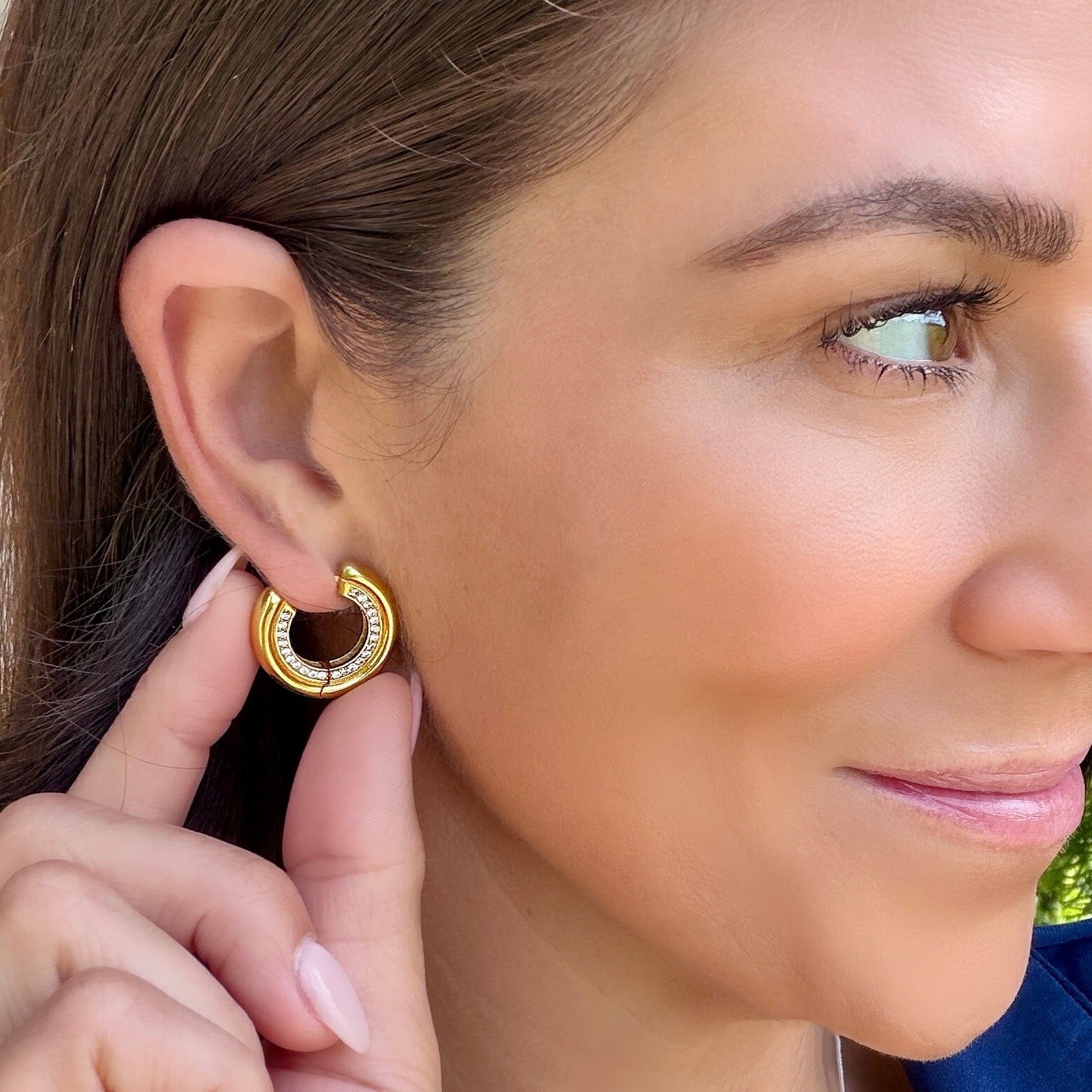 gold plated hoops featuring paved czs on the side