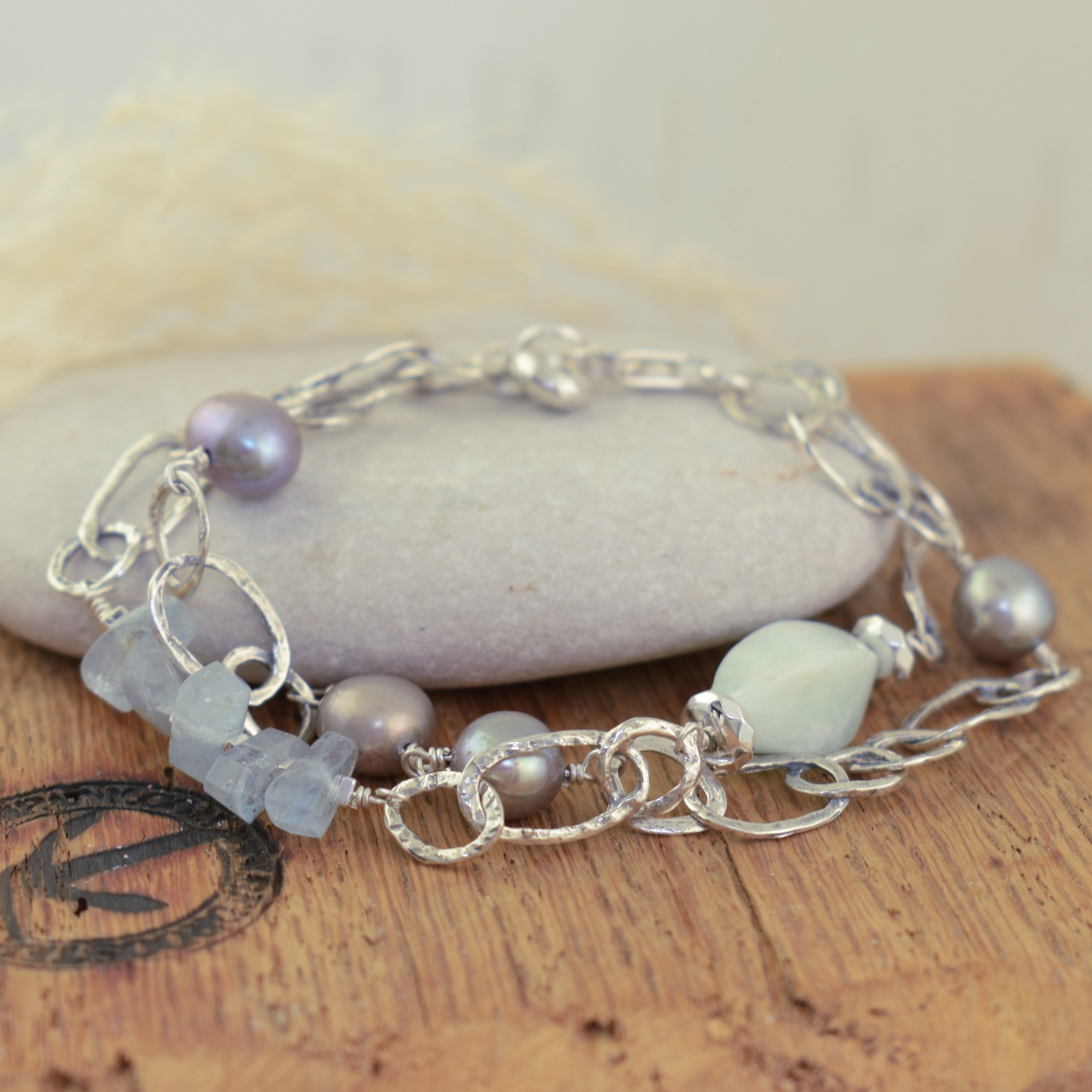 sterling silver link bracelet featuring various aqua and hematite beads and grey freshwater pearls