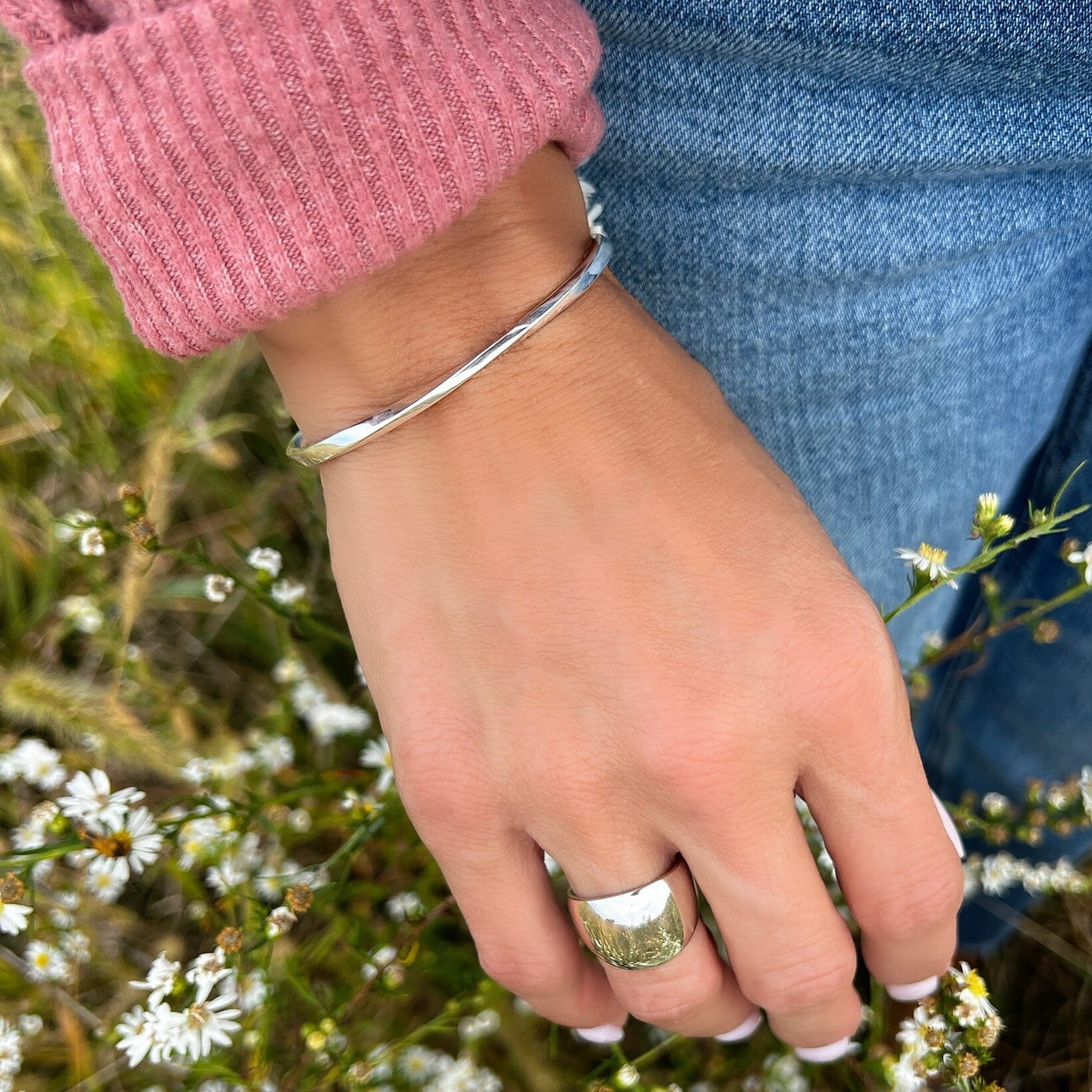 sleek sterling silver cuff bracelet with a wavy ridge on top