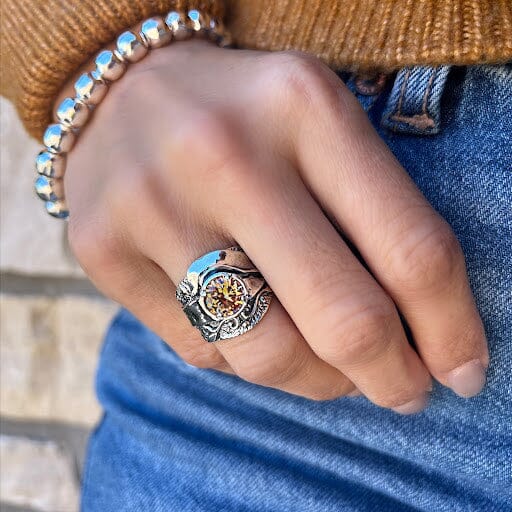 sterling silver ring with unique band, featuring a round prong set golden CZ stone