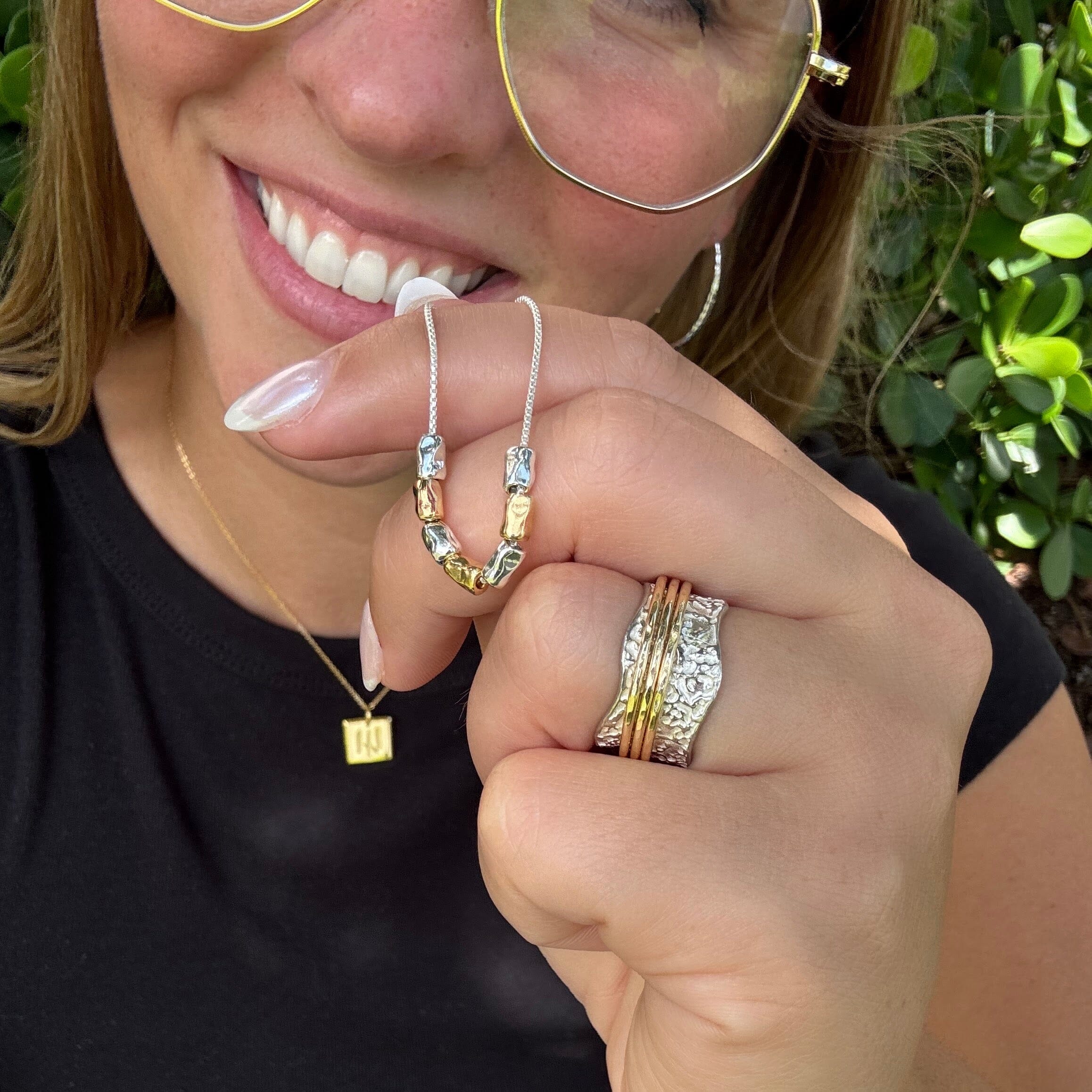 delicate silver necklace featuring sterling silver and gold plated barrel shaped beads