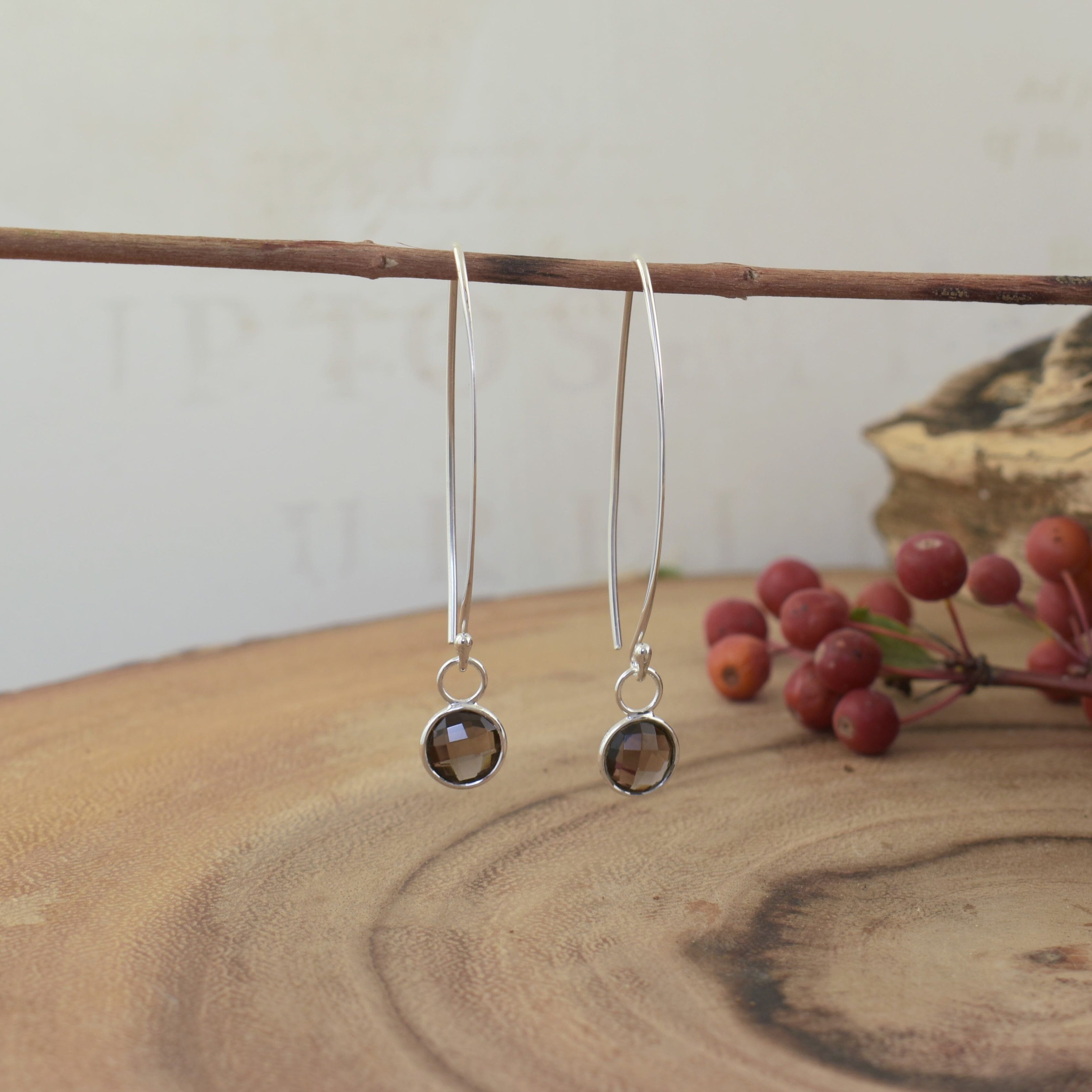 v-wire earrings in sterling silver featuring faceted smoky quartz dangles