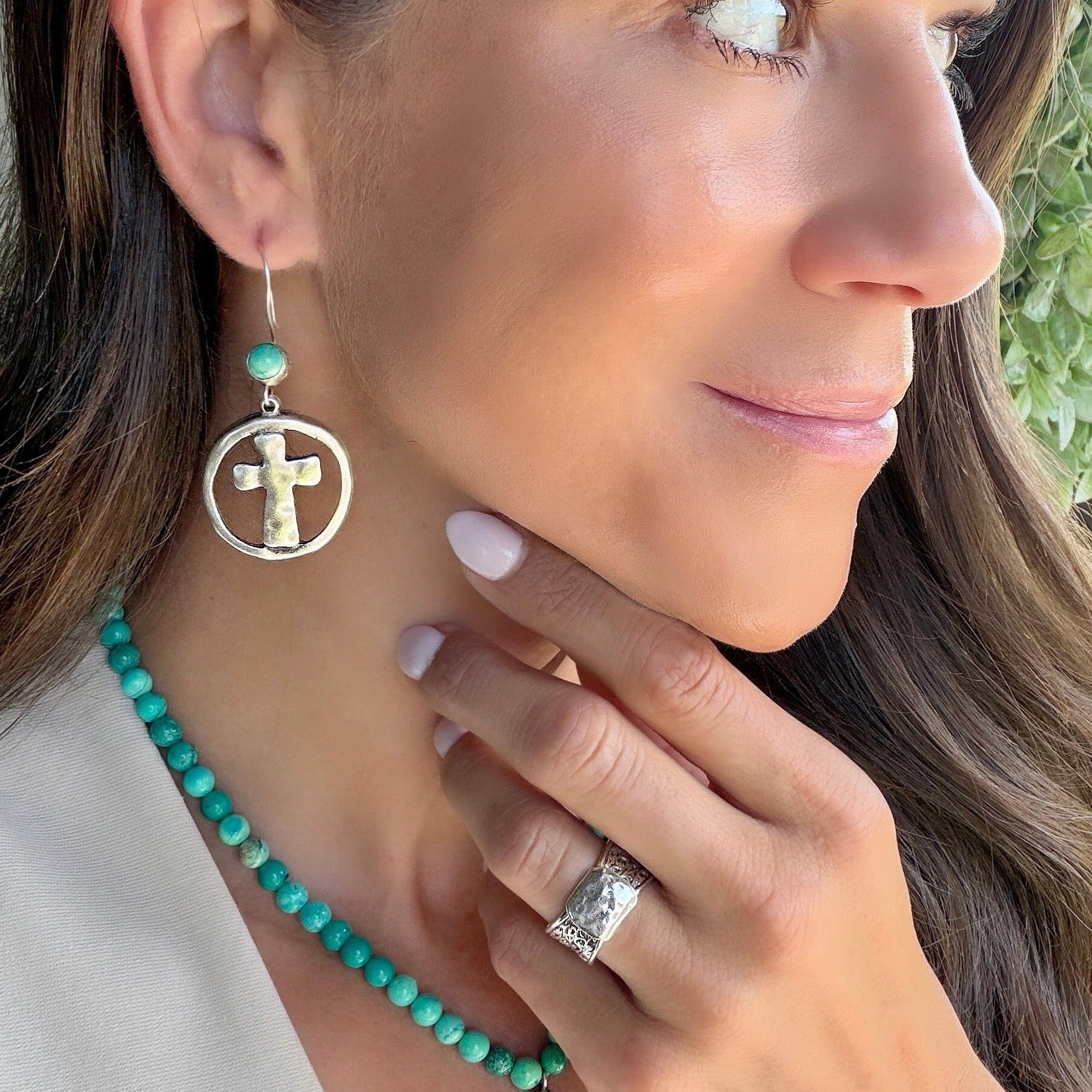 christian cross earrings featuring a reconstructed turquoise stone