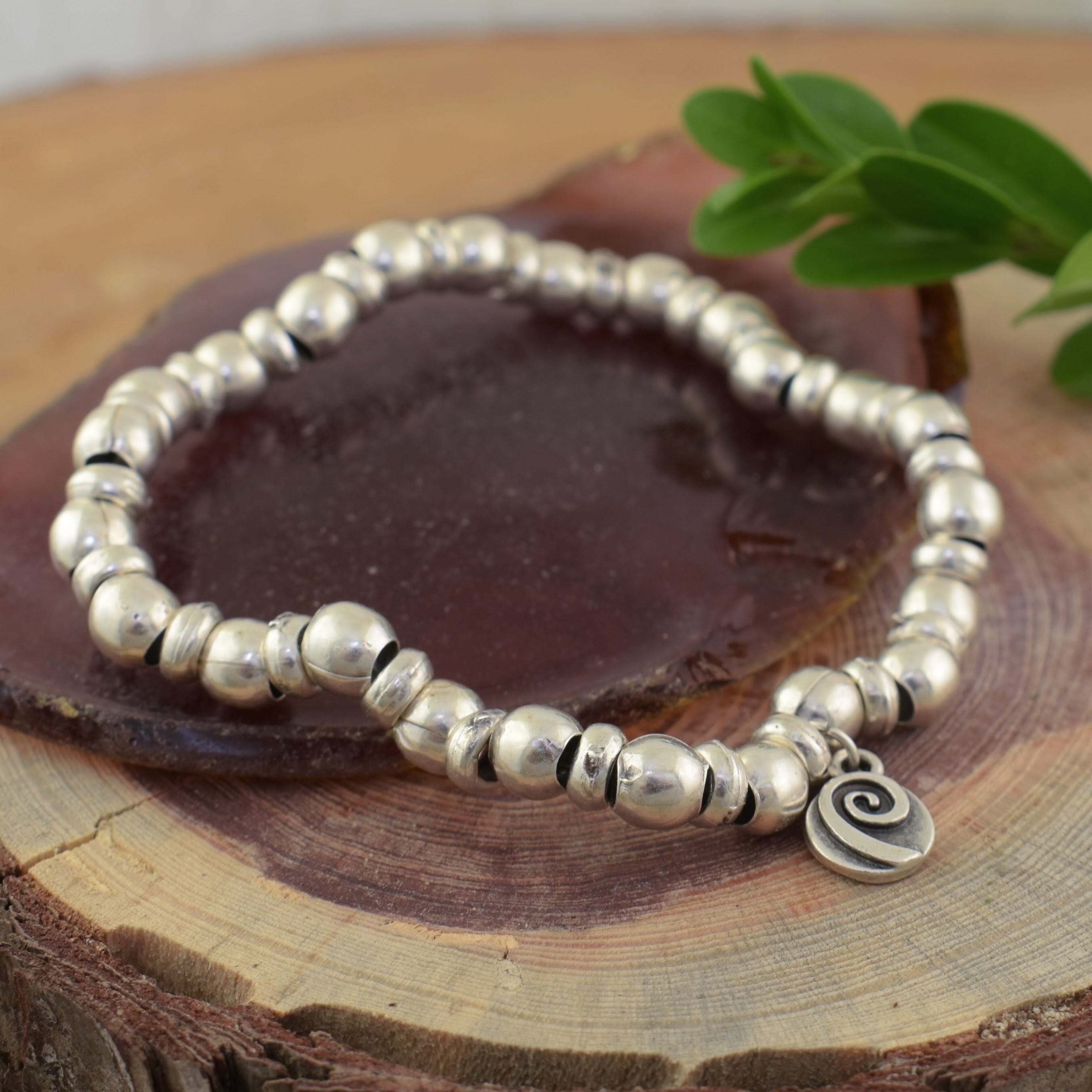 Zamak beaded stretch bracelet with round and saucer beads