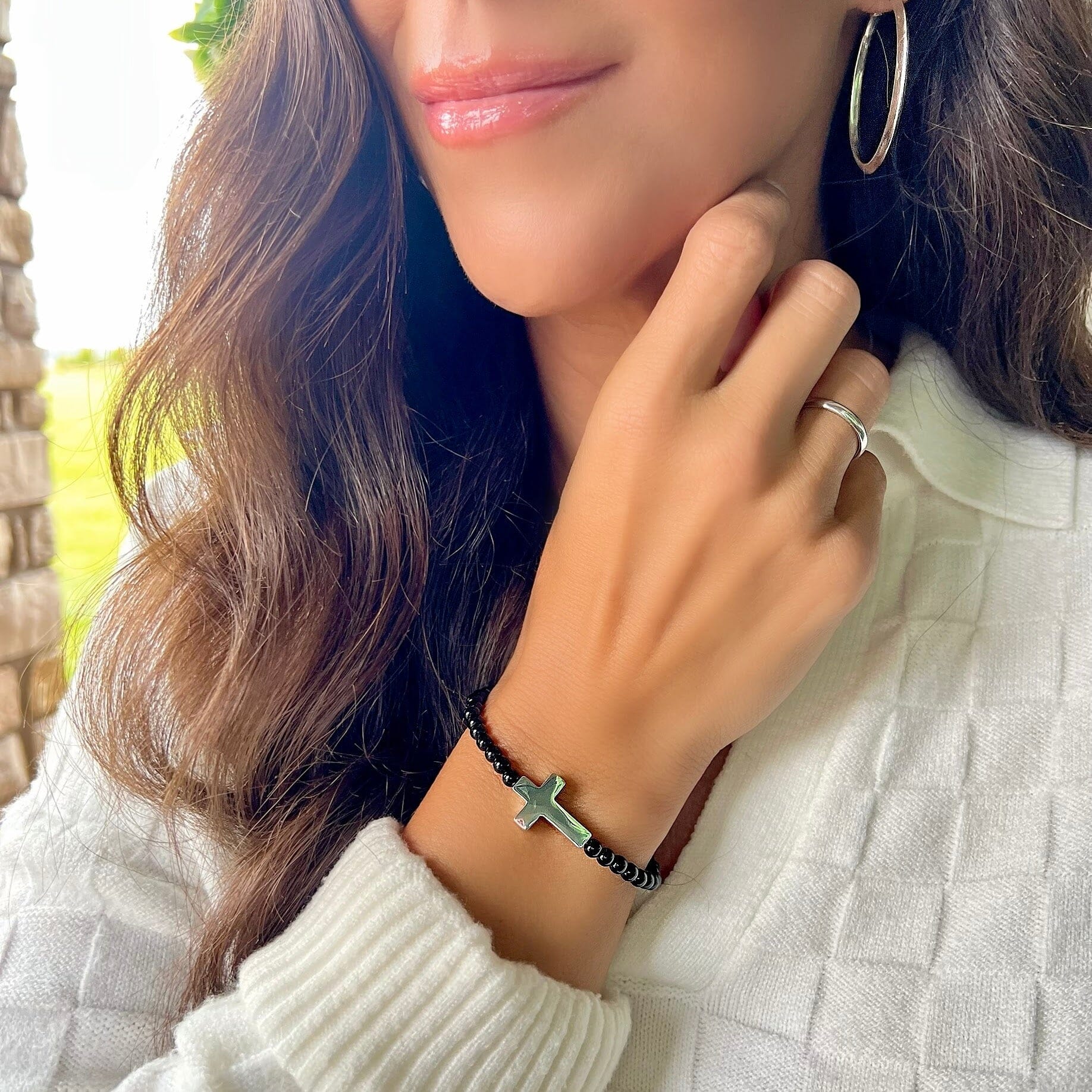 Beaded cross bracelet paired with the plain jane ring and the overtly oval earrings
