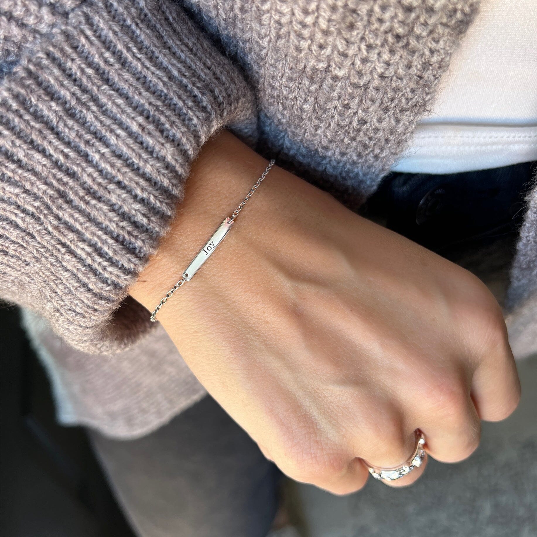 delicate silver bar bracelet stamped with Joy