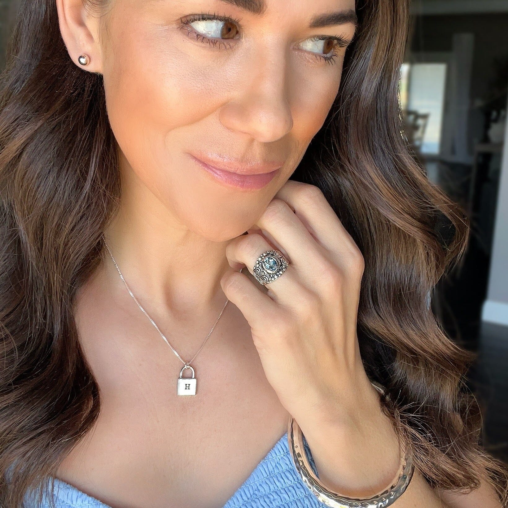 Blu Bayou Ring featuring a blue topaz gemstone with silver designs on an oxidized band