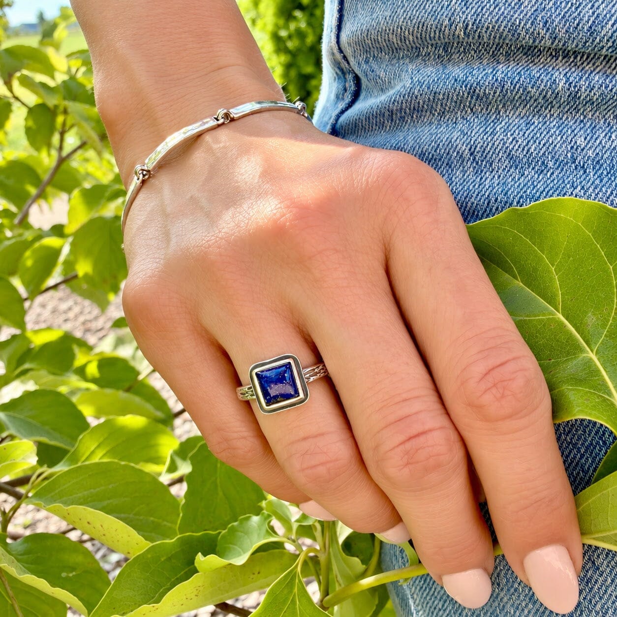 square shaped blue lapis stone bezel-set in a .925 sterling silver ring