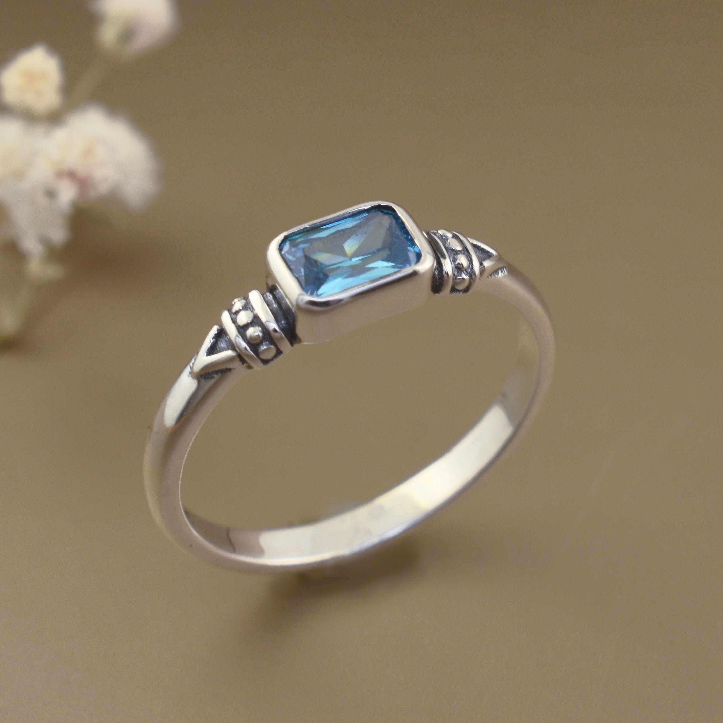 Handcrafted sterling silver ring with blue stone sparkle