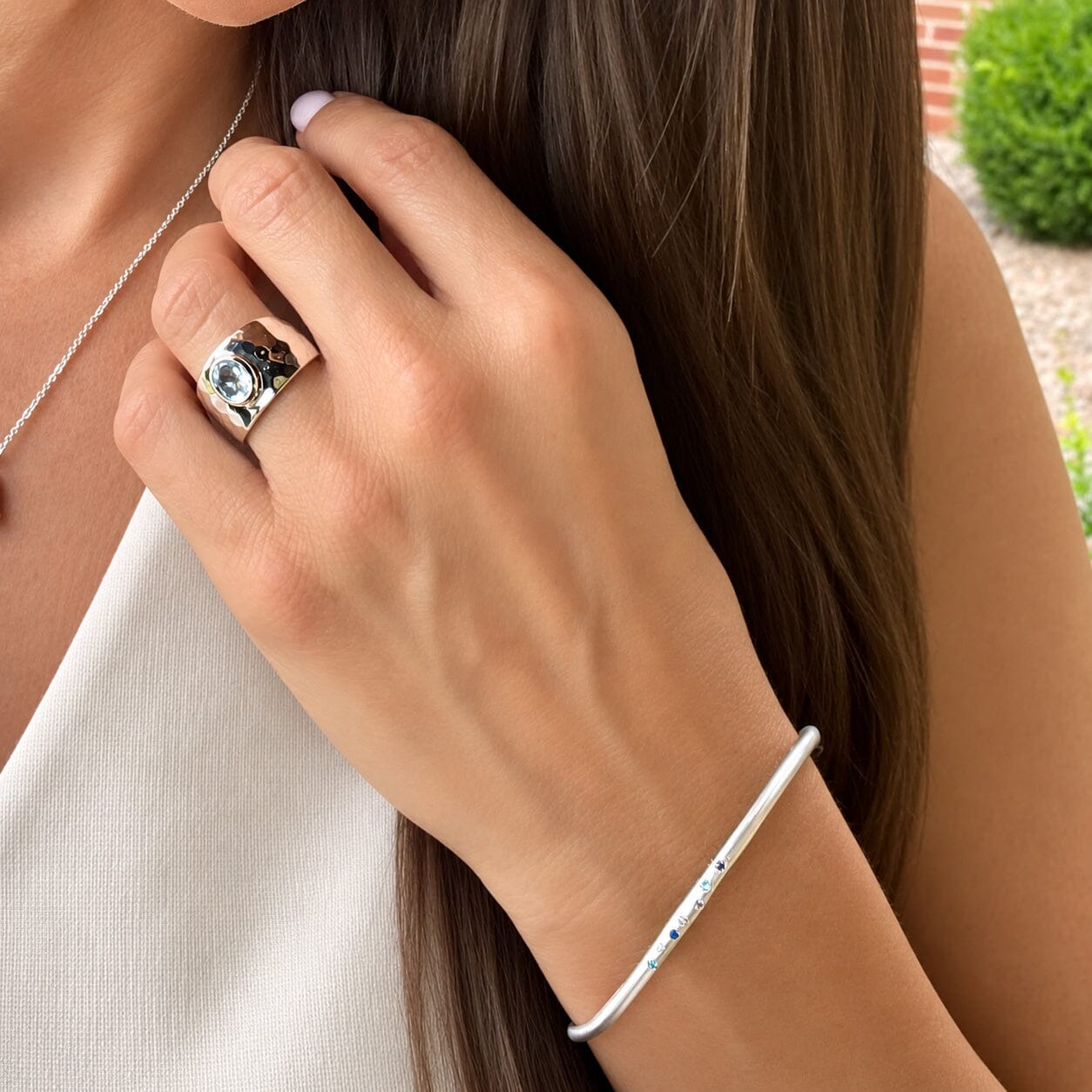 thin silver bangle with blue cz stones