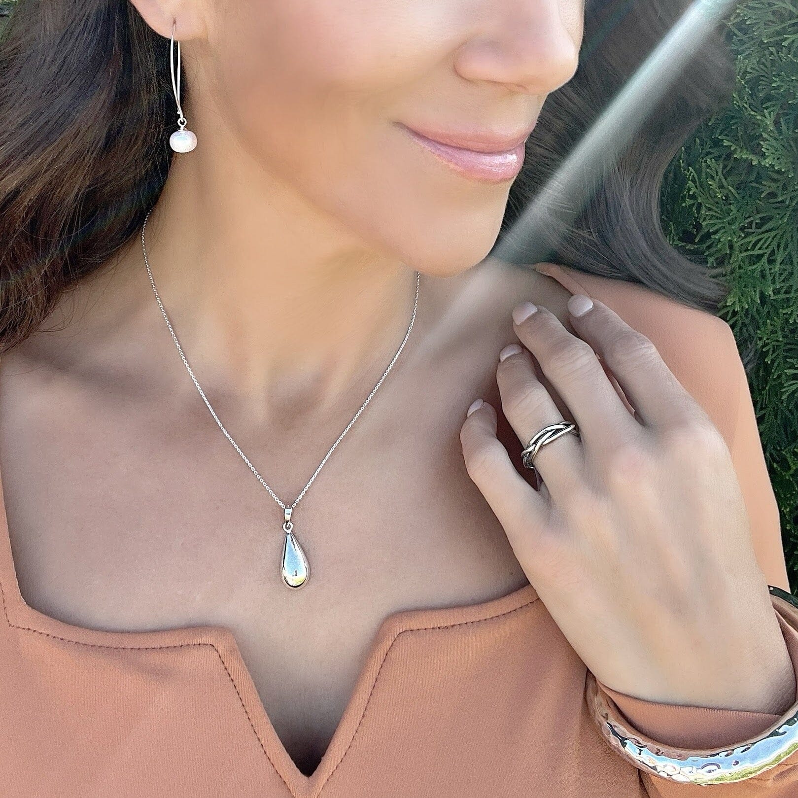 handcrafted sterling silver necklace called bottled tears