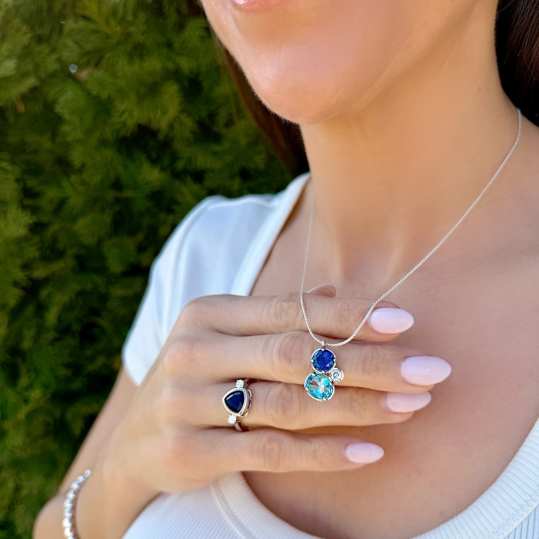 blue and clear cubic zirconia pendant on a delicate sterling silver chain