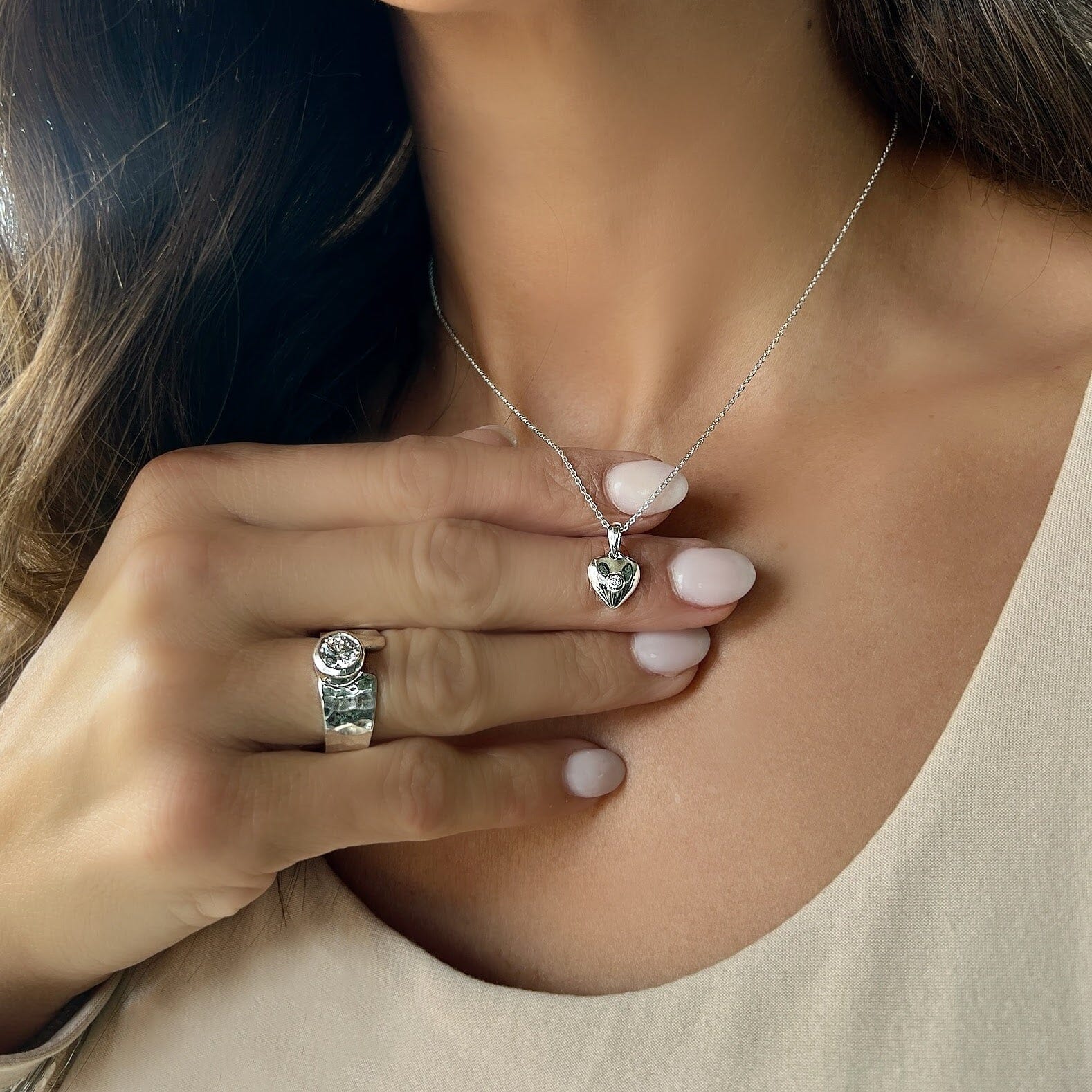 dainty heart necklace pendant with a tiny cubic zirconia center stone