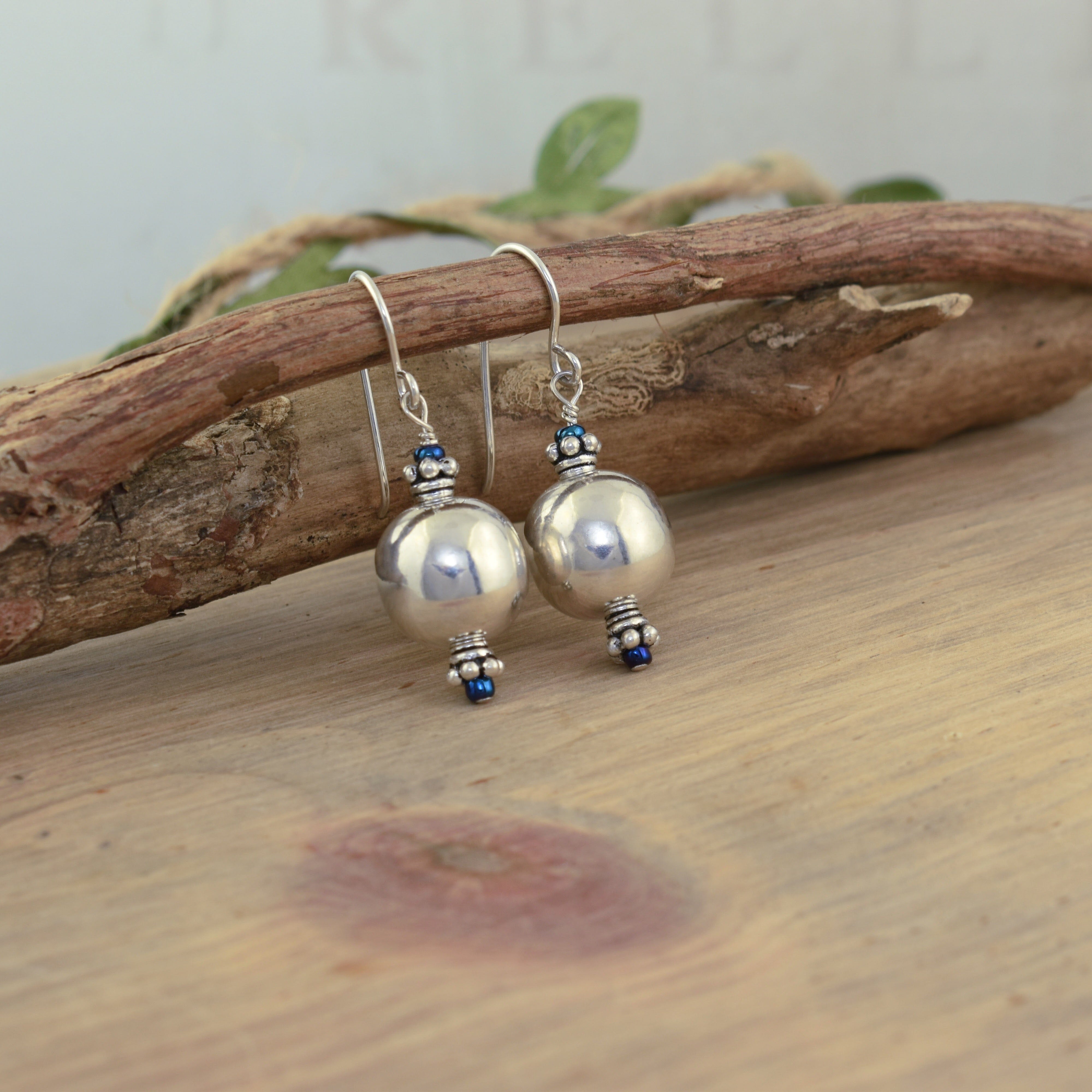 .925 sterling silver ball shaped earrings with bogo glass accents