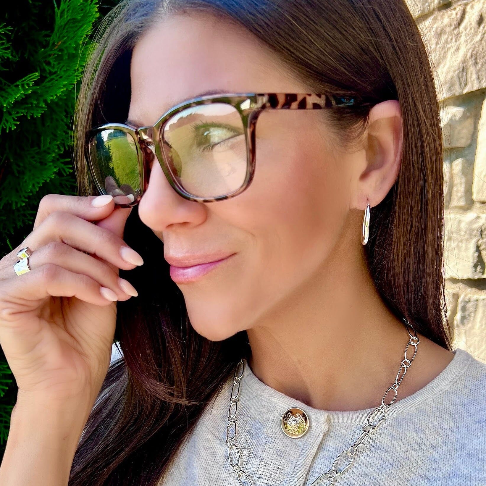 dainty v-snap sterling silver hoops in an oval shape