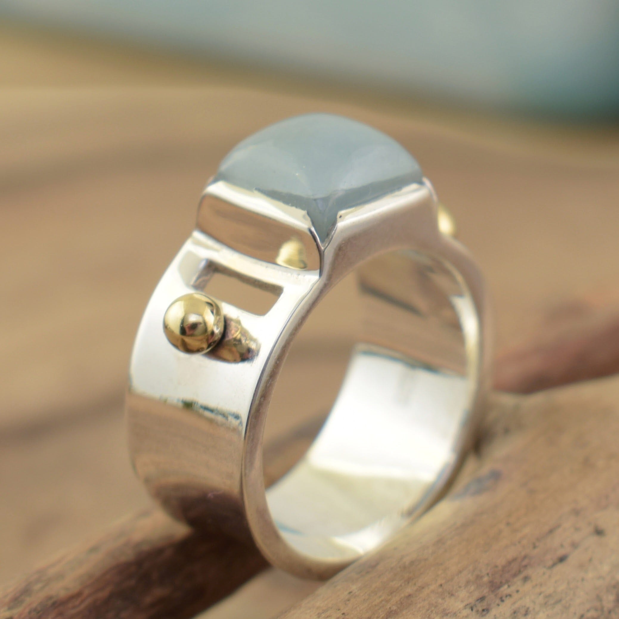 Milky aqua stone with brass details 