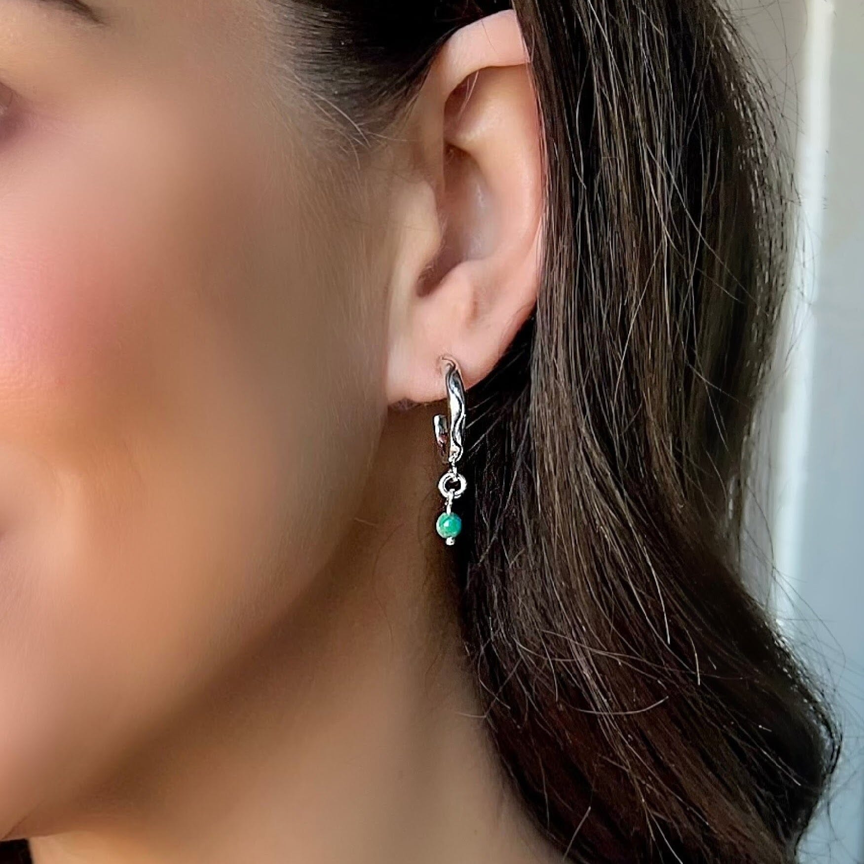 sterling silver earring with a dangle turquoise bead