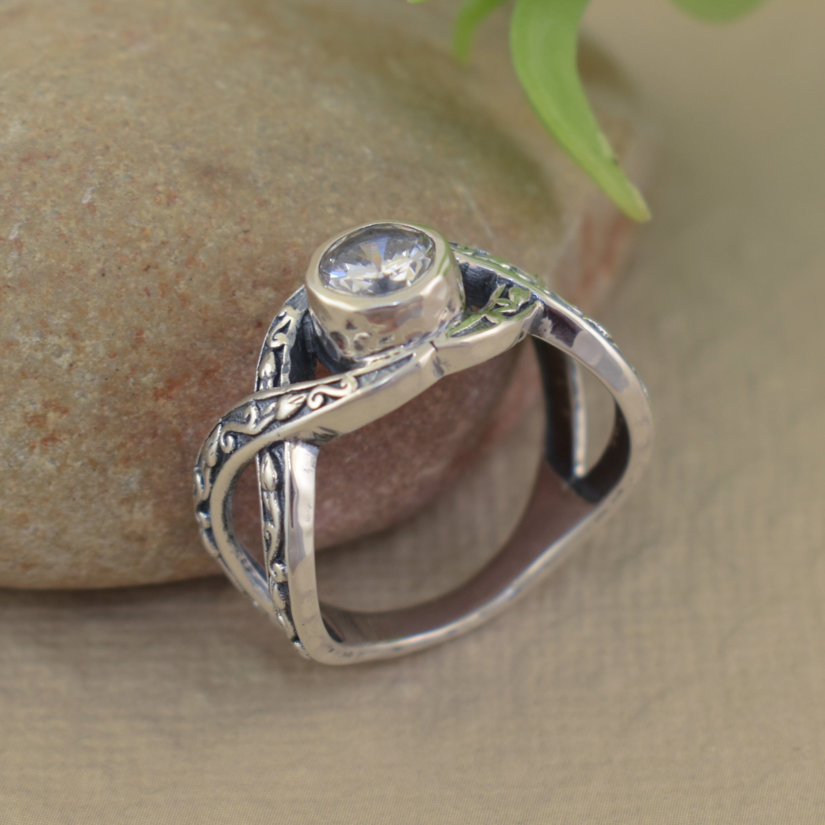 Designer-inspired sterling silver ring with round cubic zirconia stone