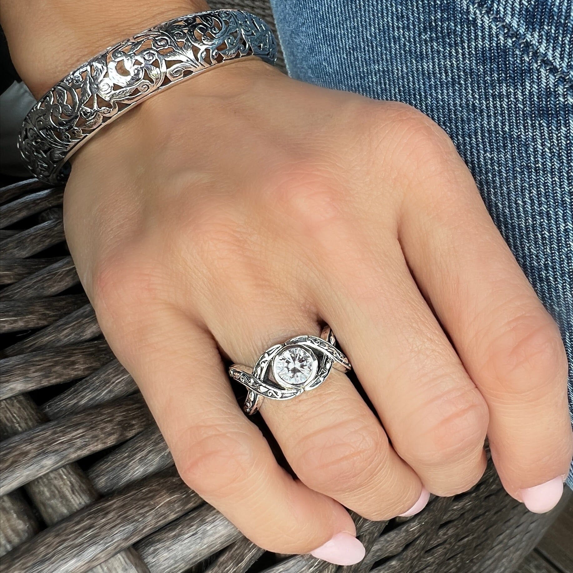 sterling silver Crisscross ring. cubic zirconia. paired with vineyard bracelet