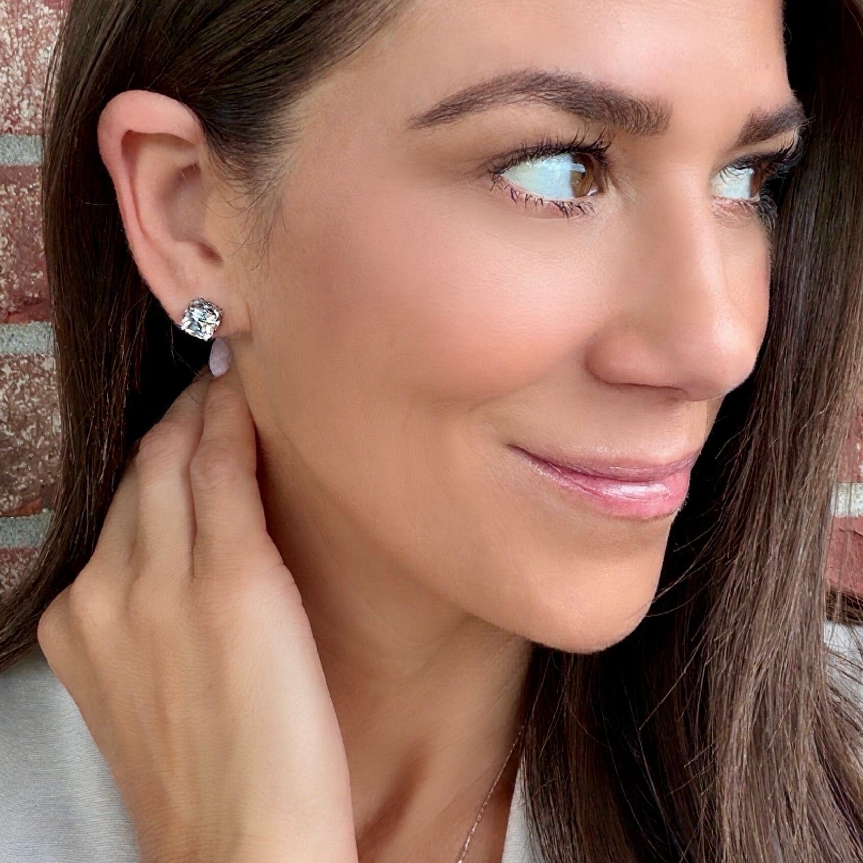 push-back post sterling silver earrings featuring a cushion cut cz stone