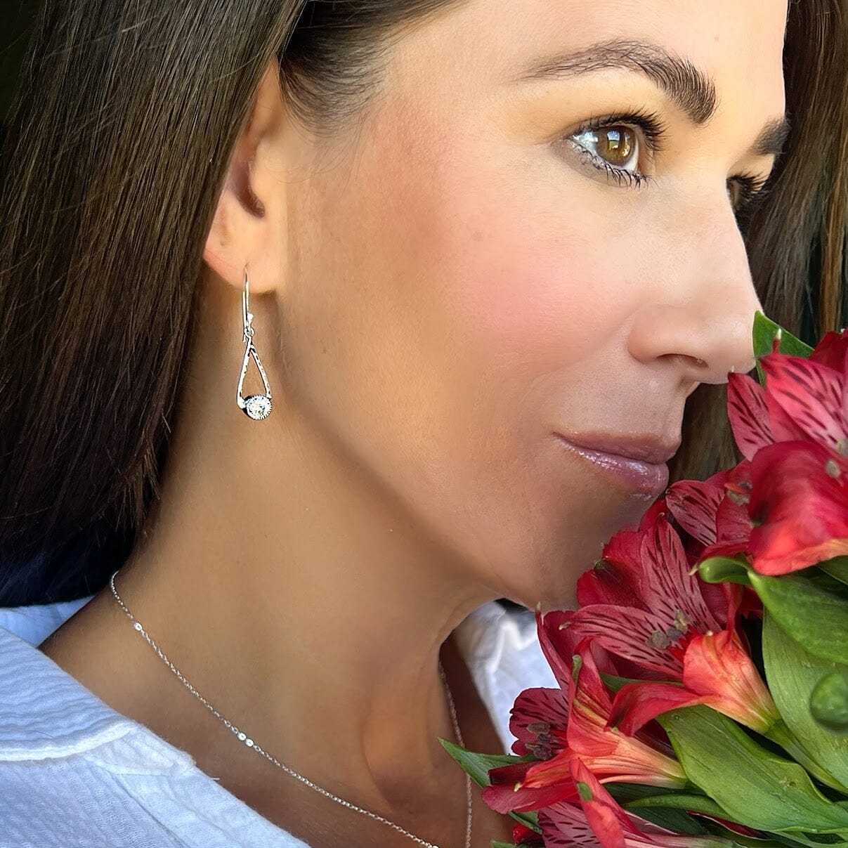 Sterling silver drop shape earrings with a CZ stone 