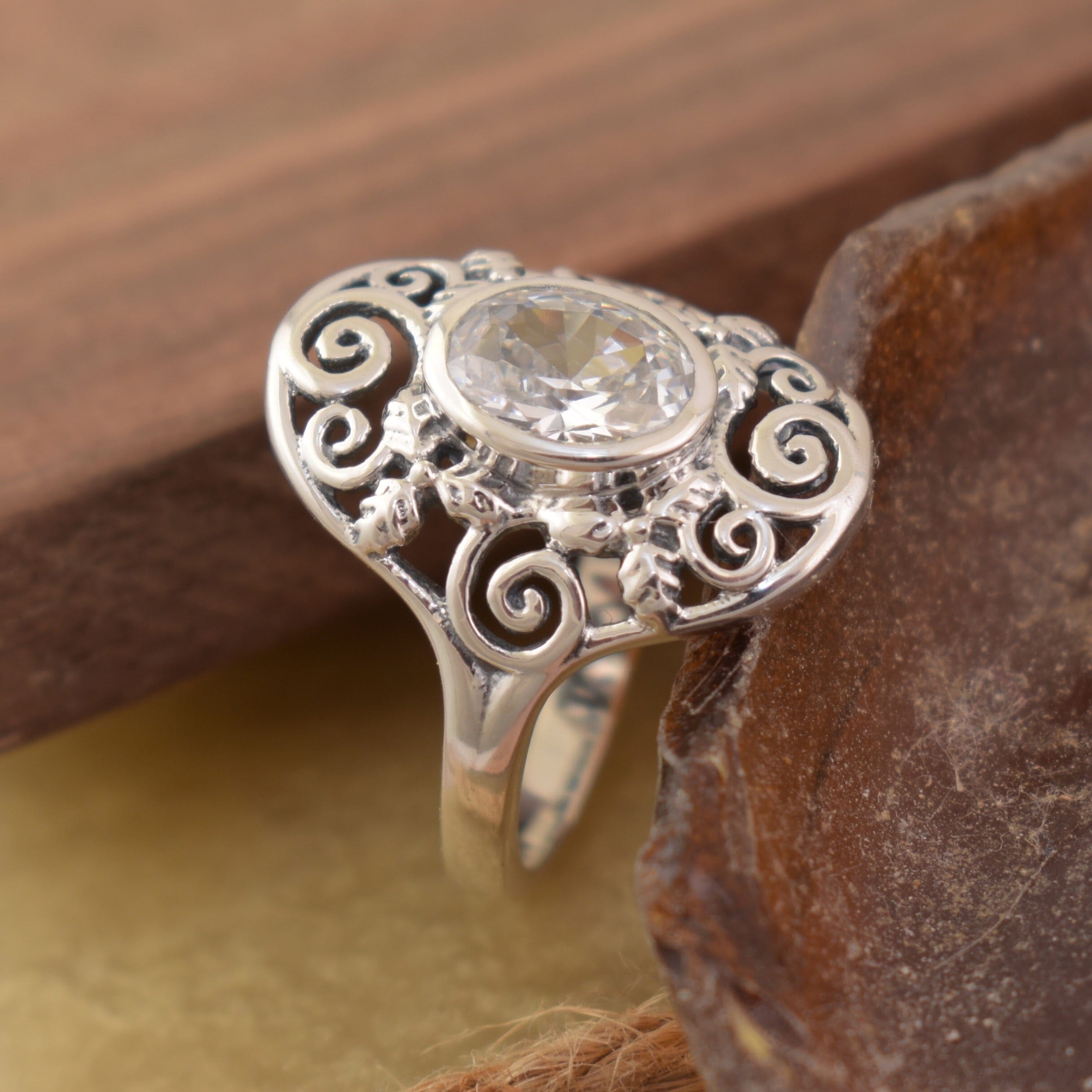 Swirl designed setting with a clear cz stone 
