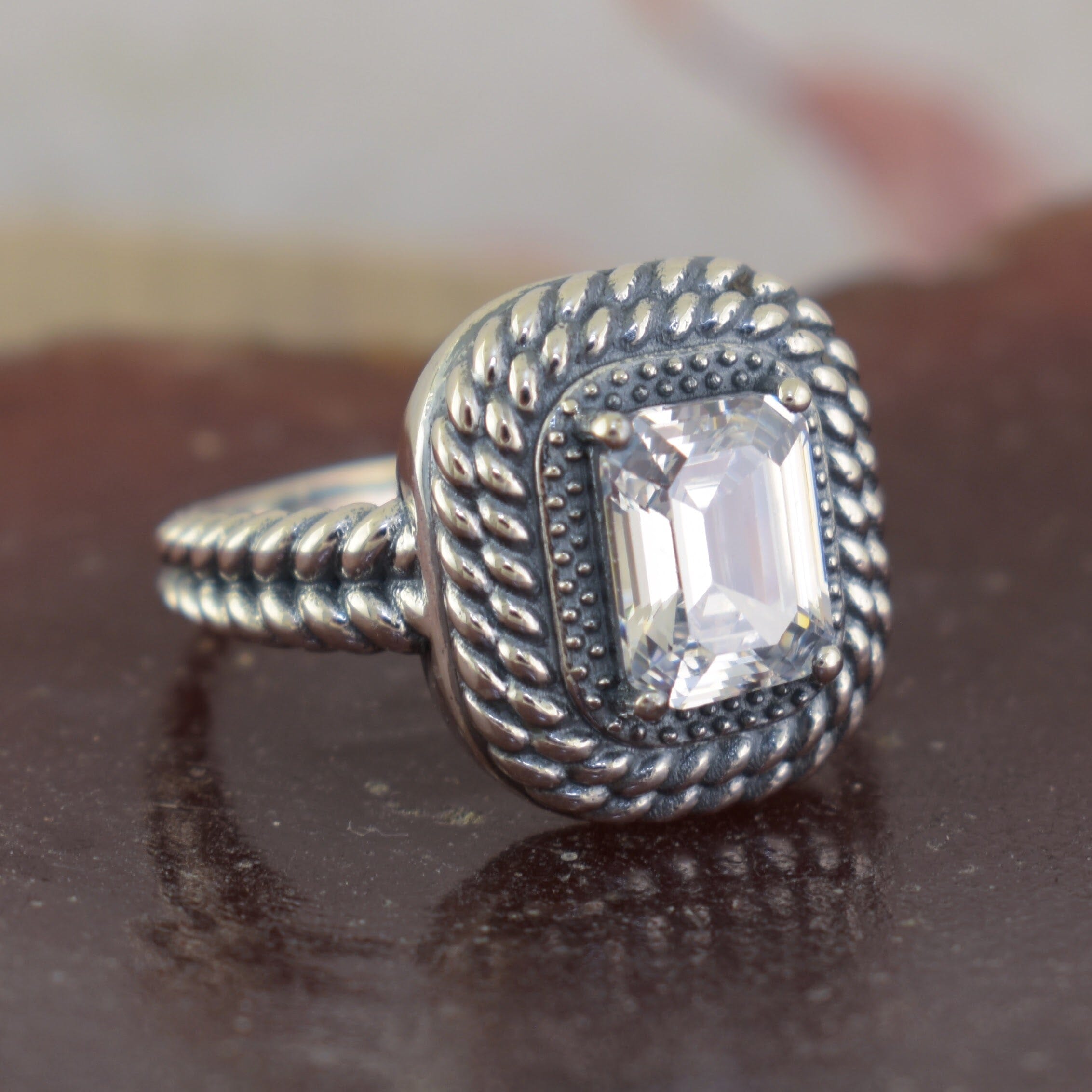 hand crafted sterling silver ring with a rectangle cut CZ stone