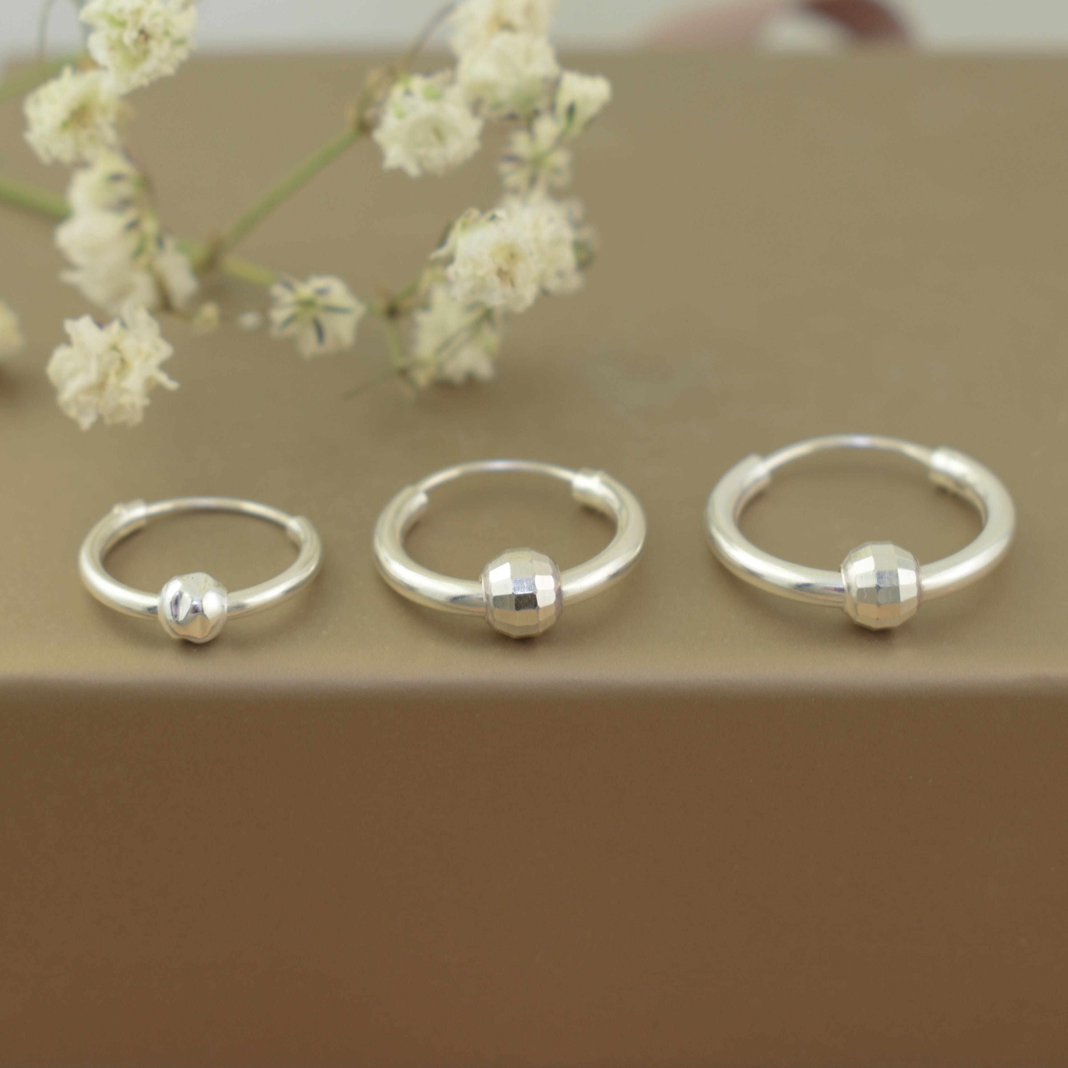 three sizes of sterling silver huggie hoops