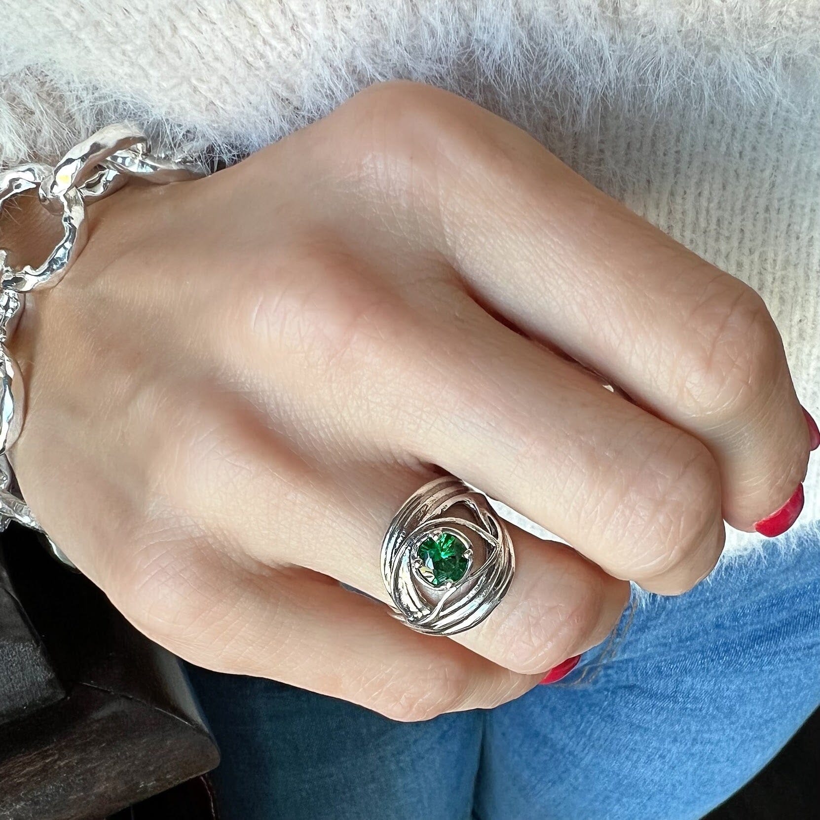 chunky silver ring with a green emerald cz stone