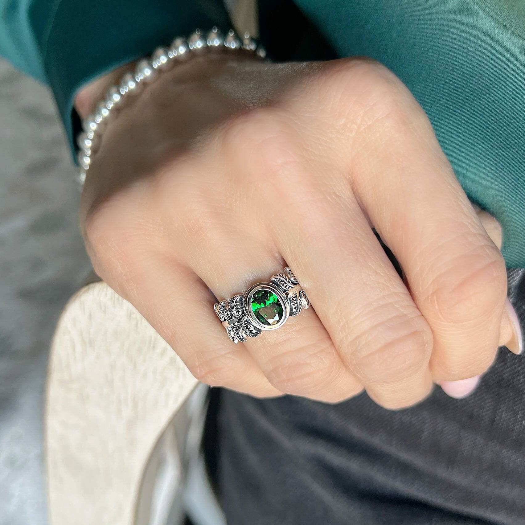 Emerald Palm Ring featuring oval emerald cz center