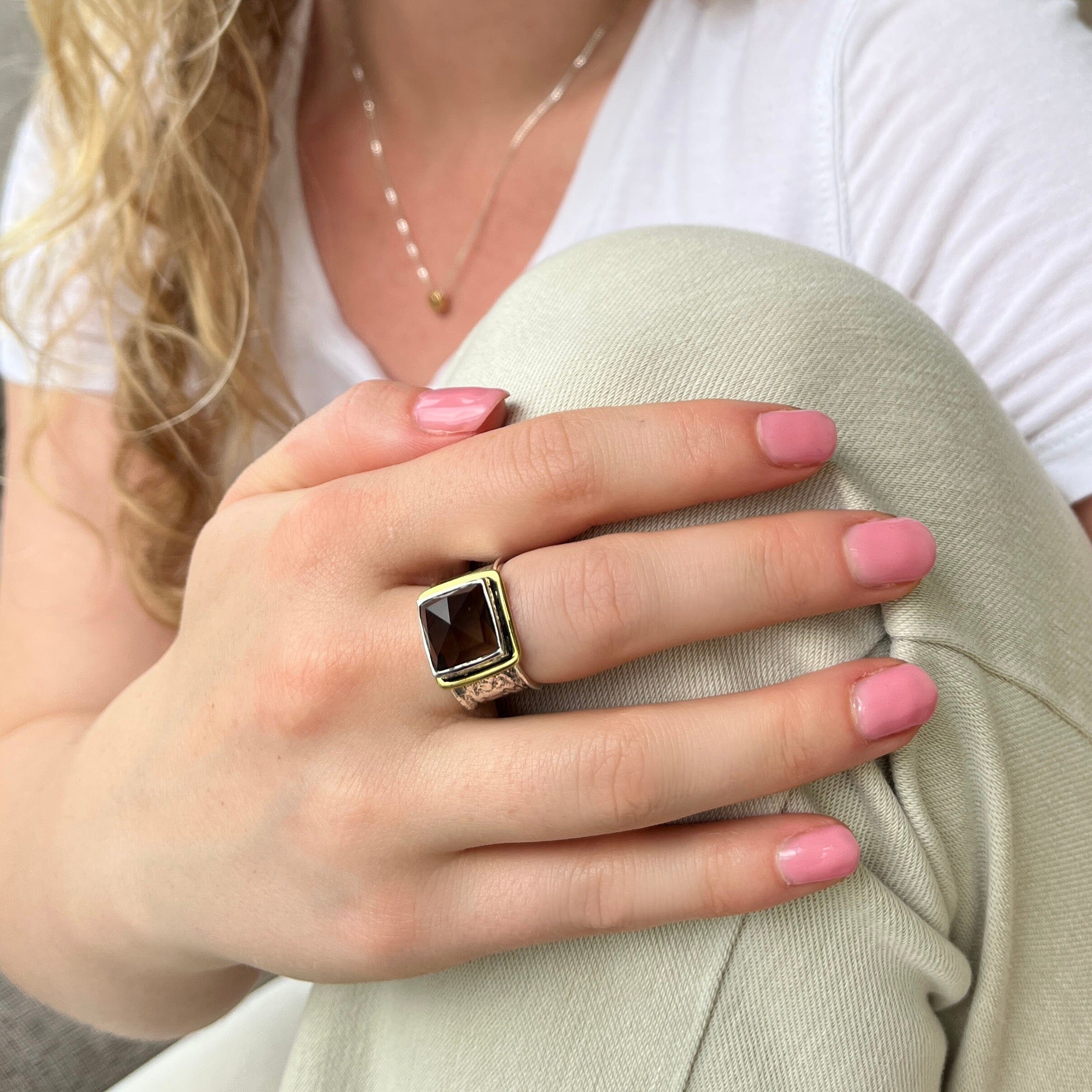 sterling silver ring with a gold band around the bezel . featuring a deep smokey quarts square stone