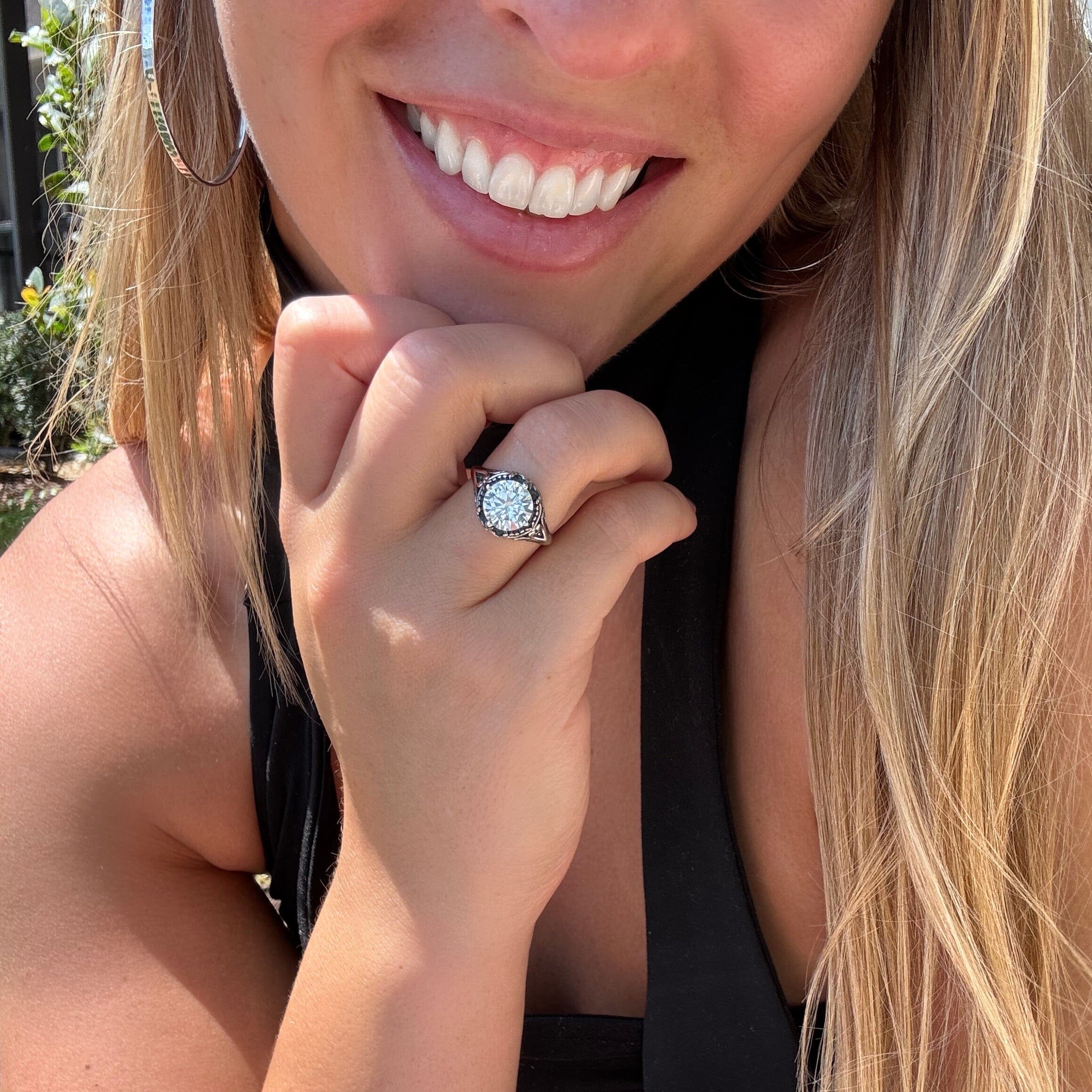 sterling silver statement ring with an oxidized and high-polished finish with a center cz