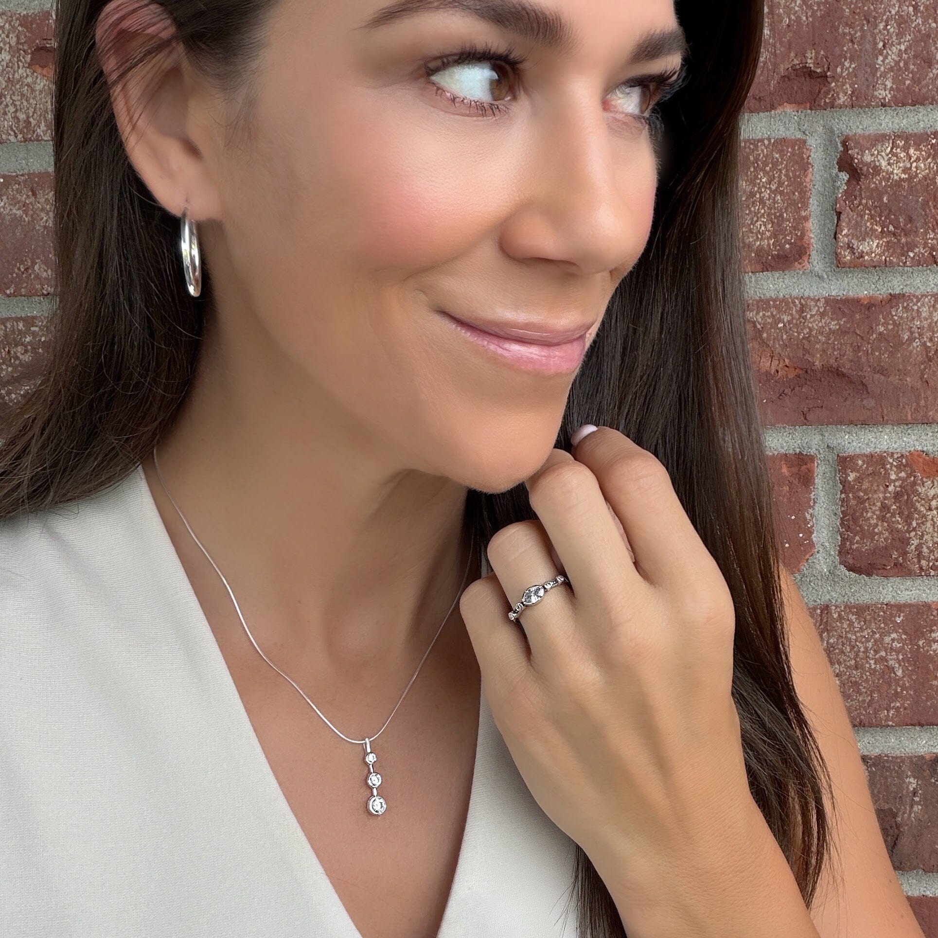 Estate of Mind Ring styled with Cliff Hanger Earrings and I Am Necklace