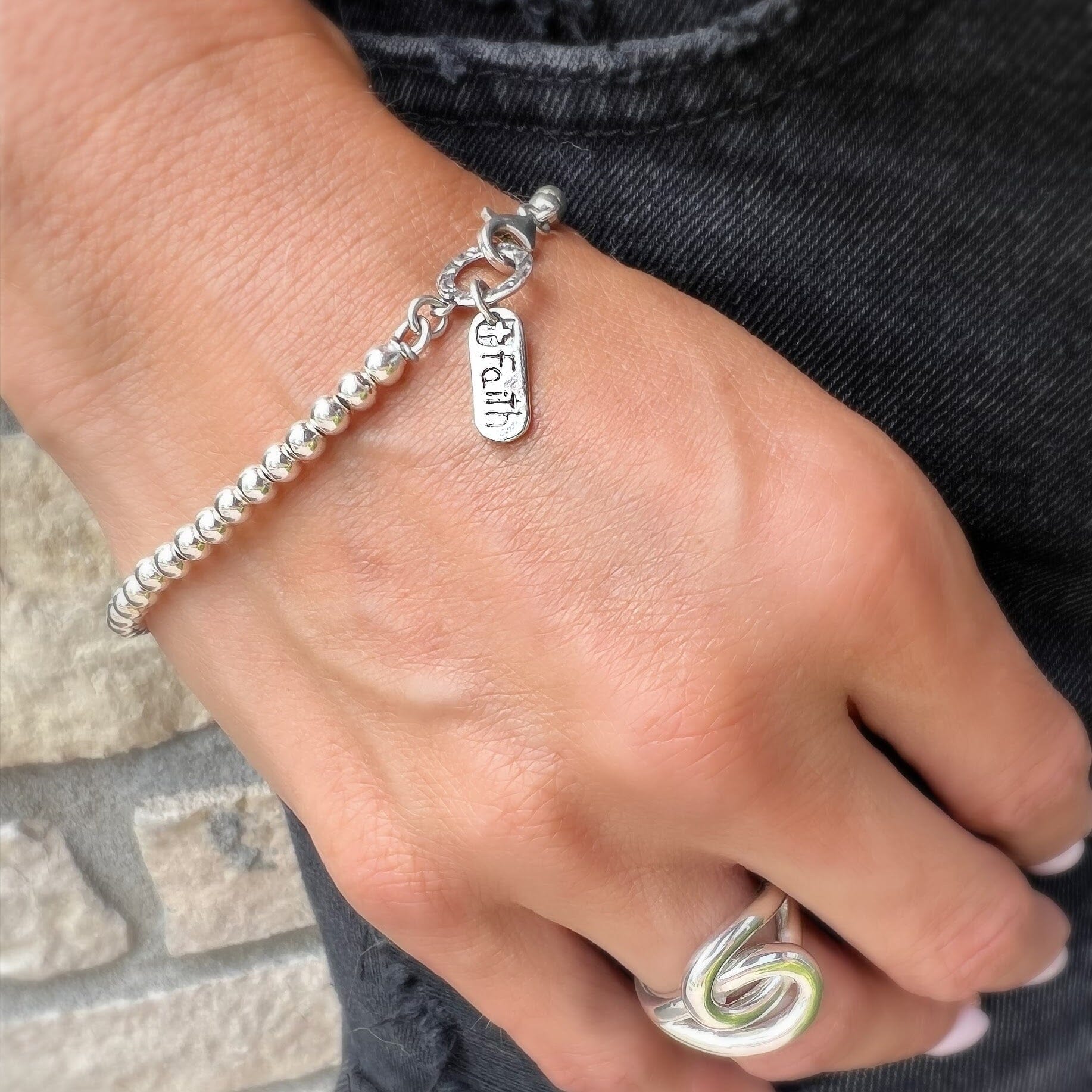 Faith Bracelet featured with Sisters Ring
