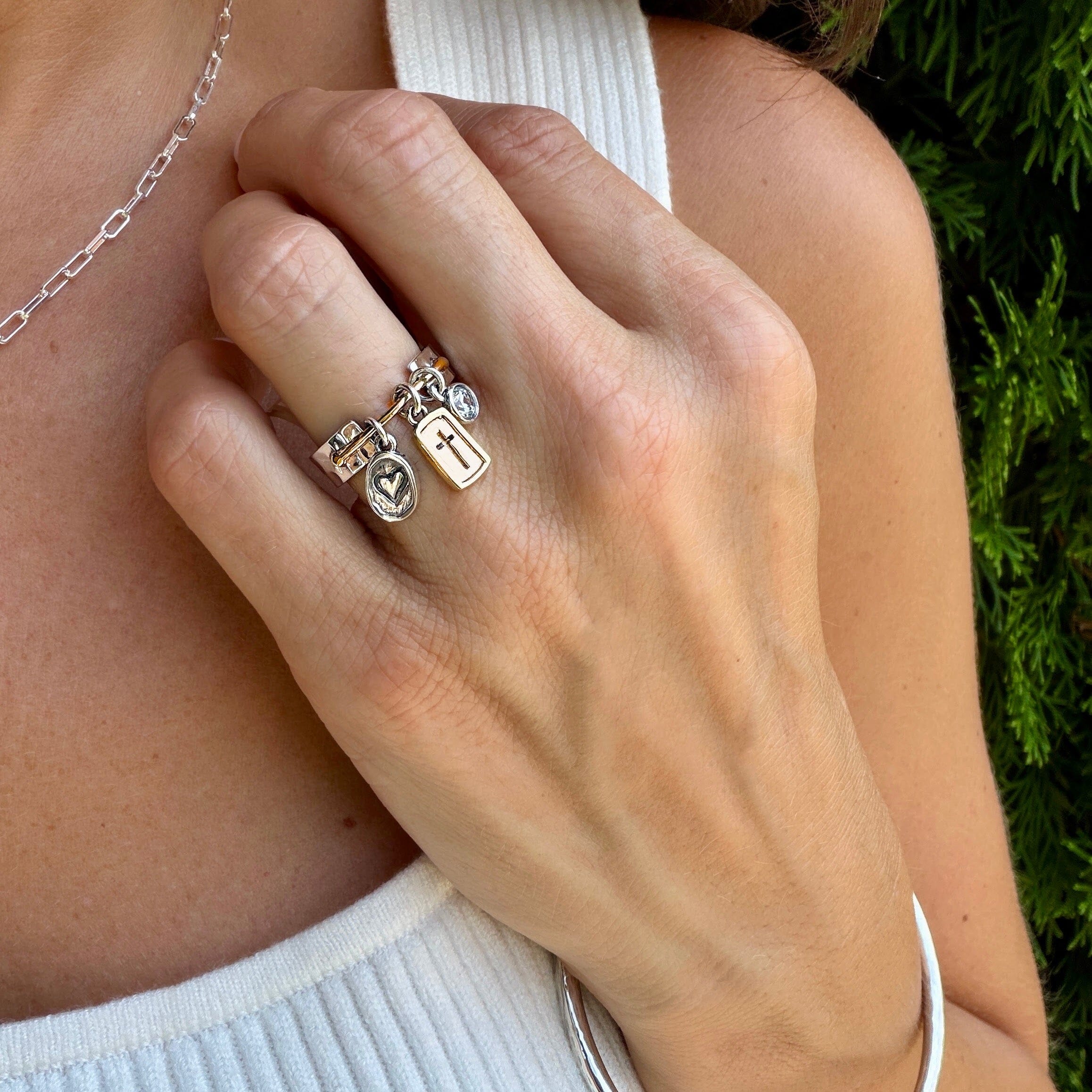 two-toned heart, cross, and cz ring