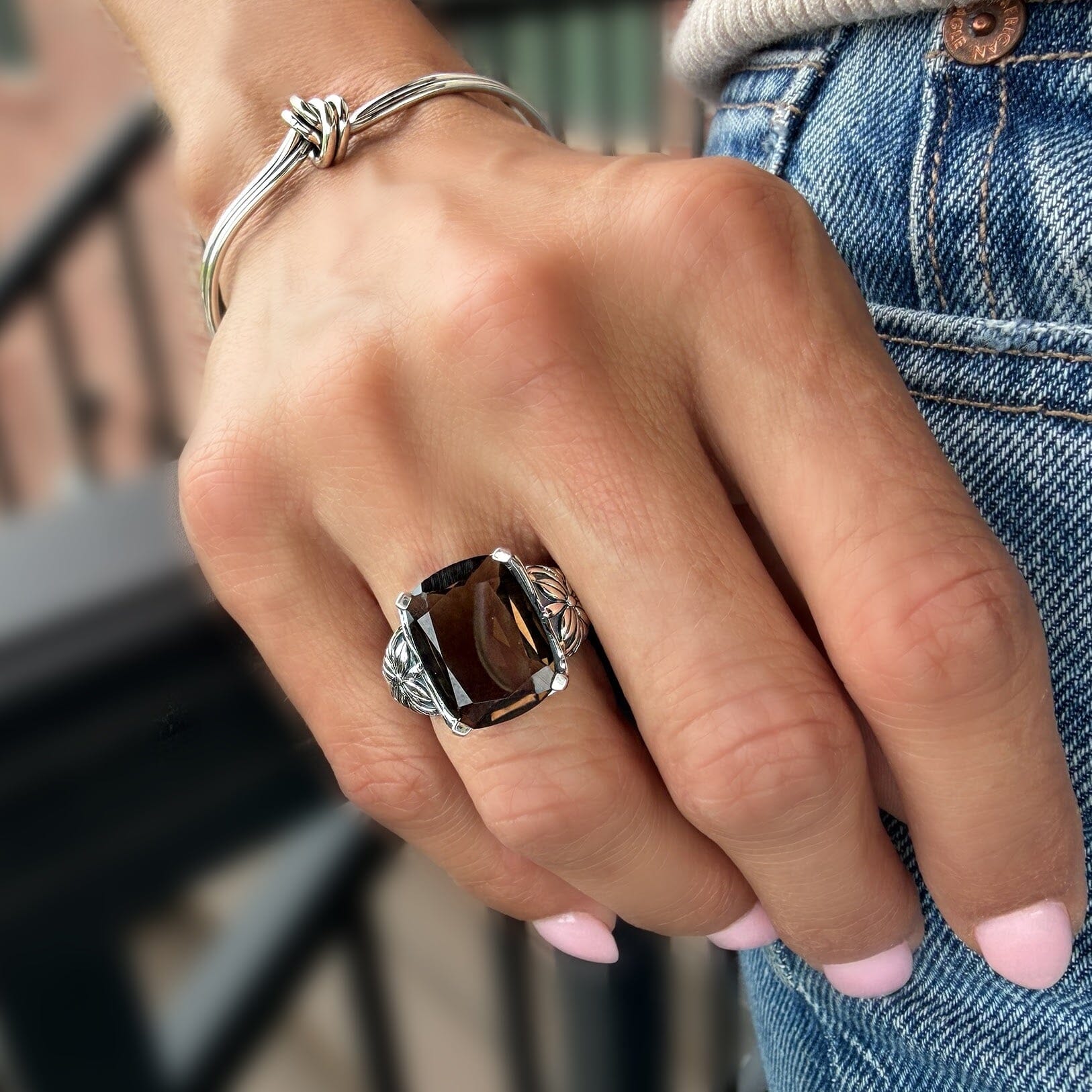 hand crafted sterling silver statement ring with a smokey quartz stone prong set