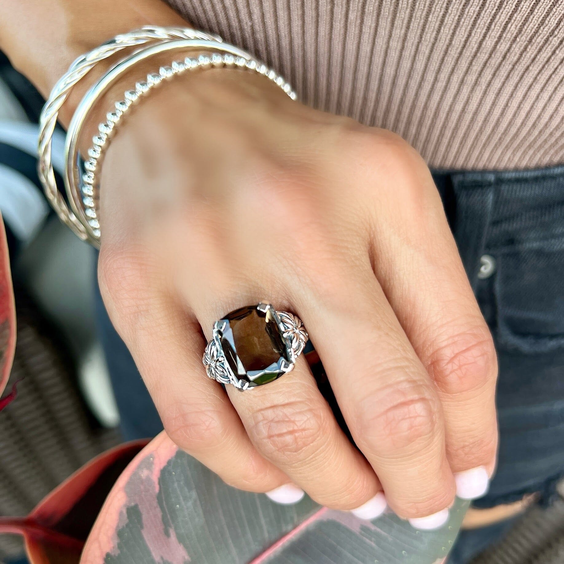 hand crafted sterling silver statement ring with a smokey quartz stone prong set