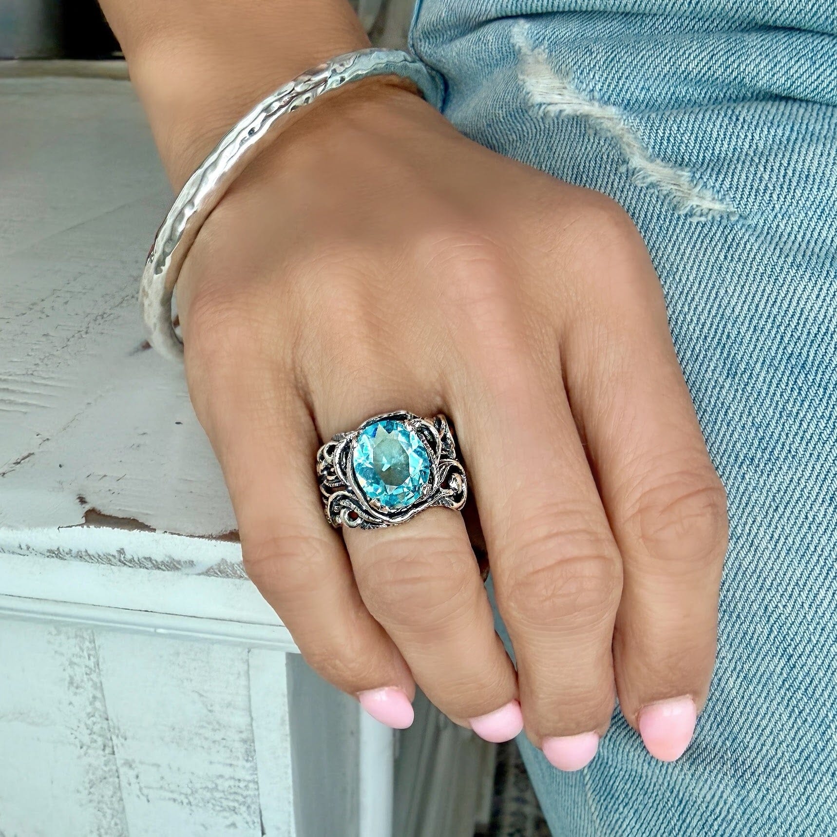 beach style ring featuring prong-set blue cz