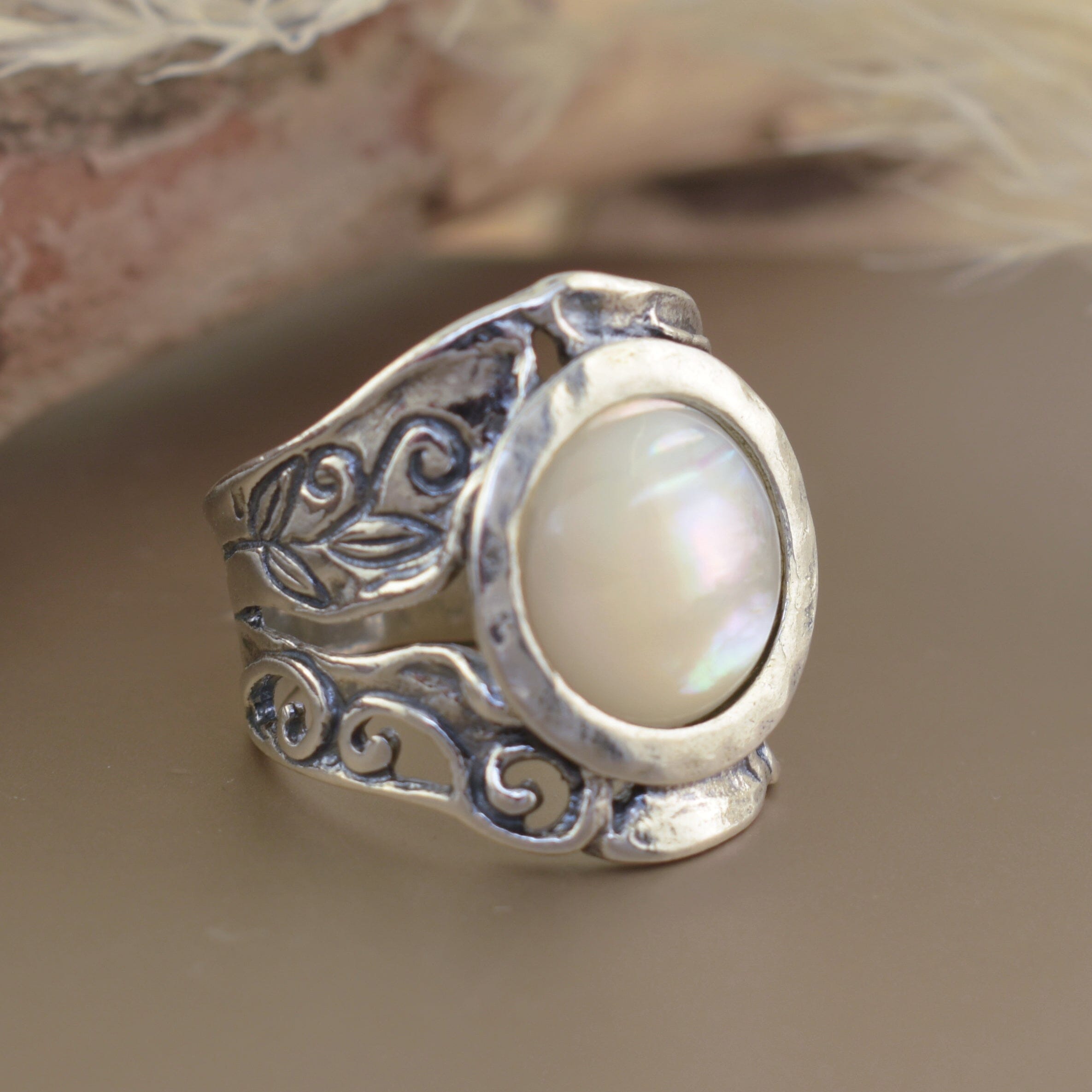 .925 sterling silver wide band ring featuring circular mother-of-pearl stone