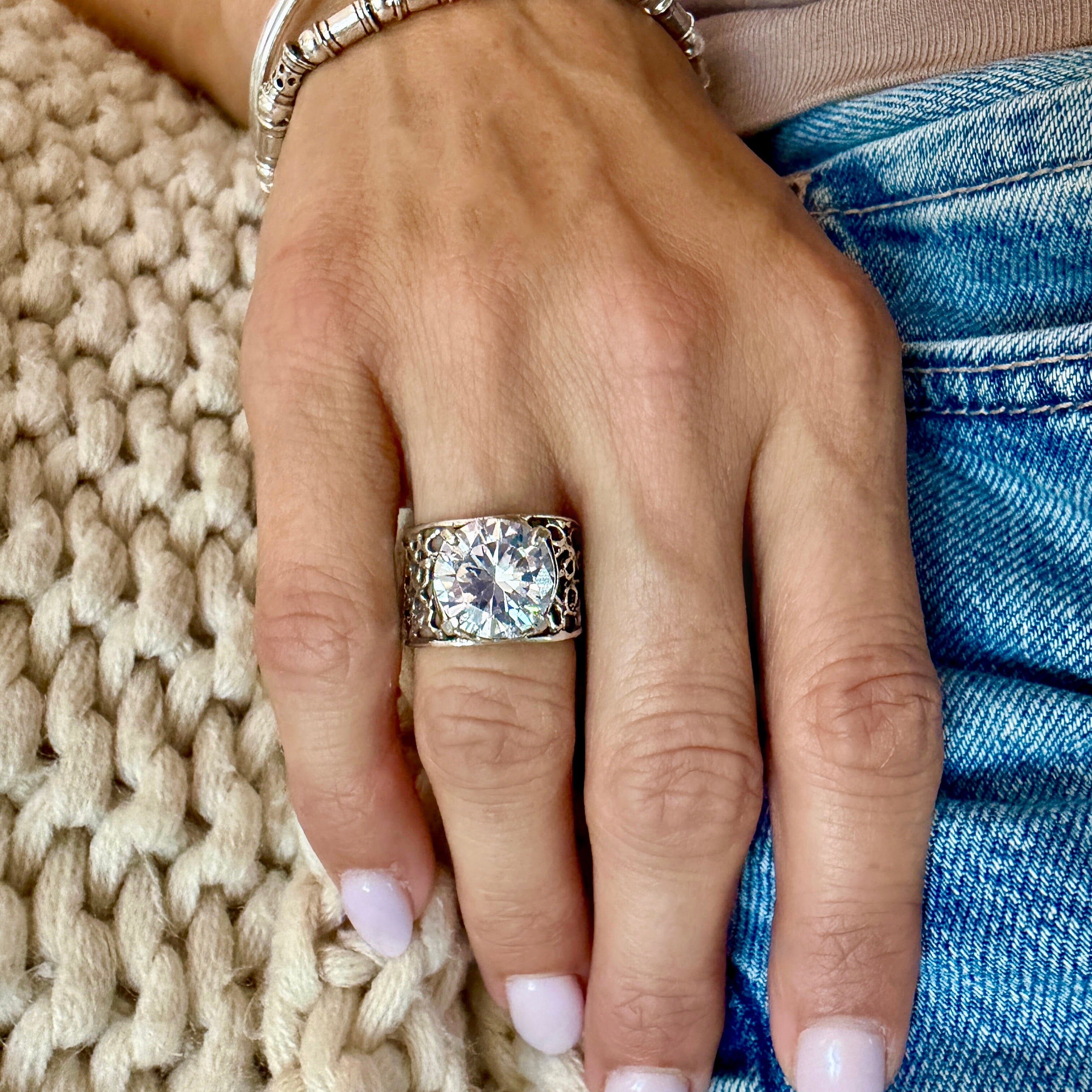silver designer ring featuring prong-set cz