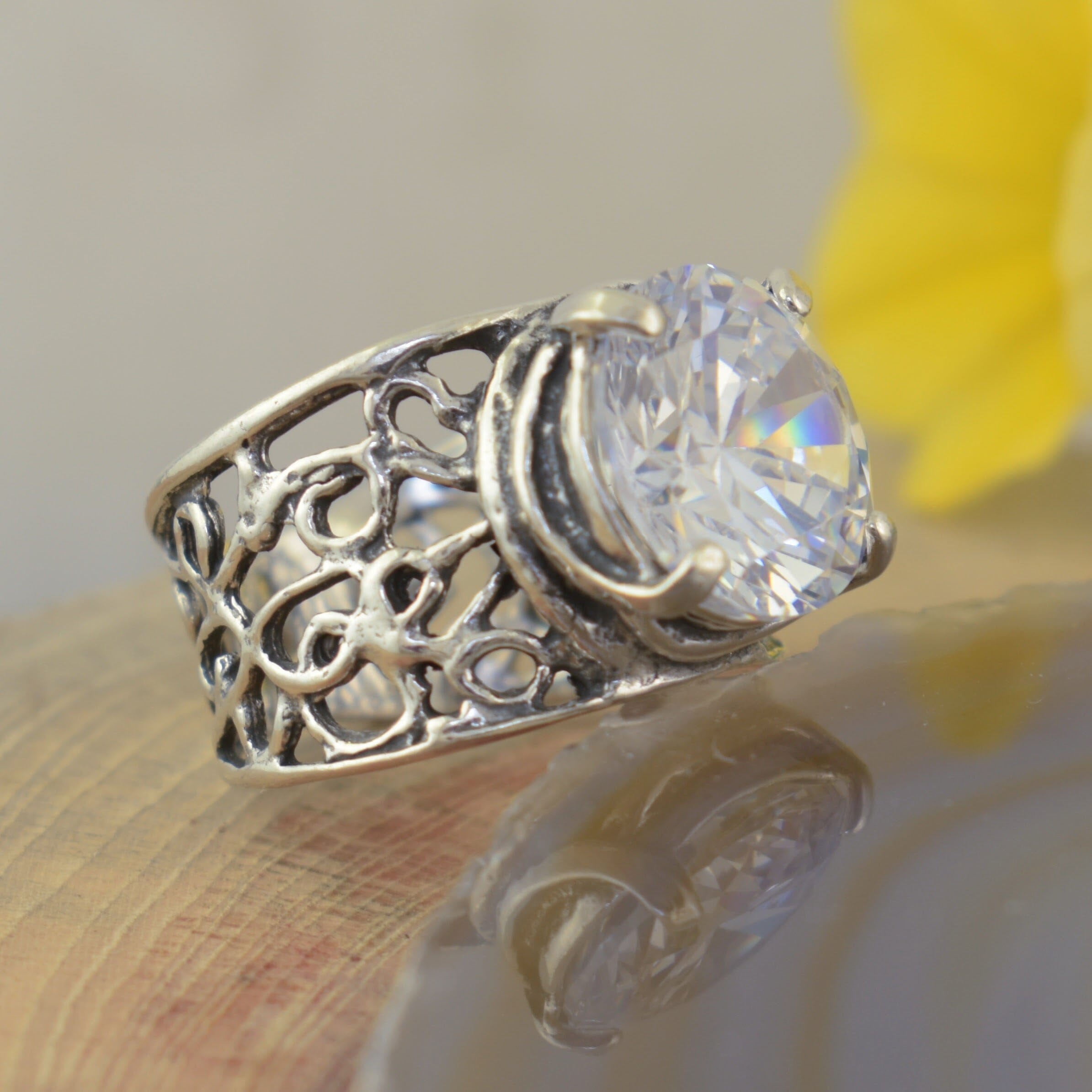wide band ring that tapers down in the back