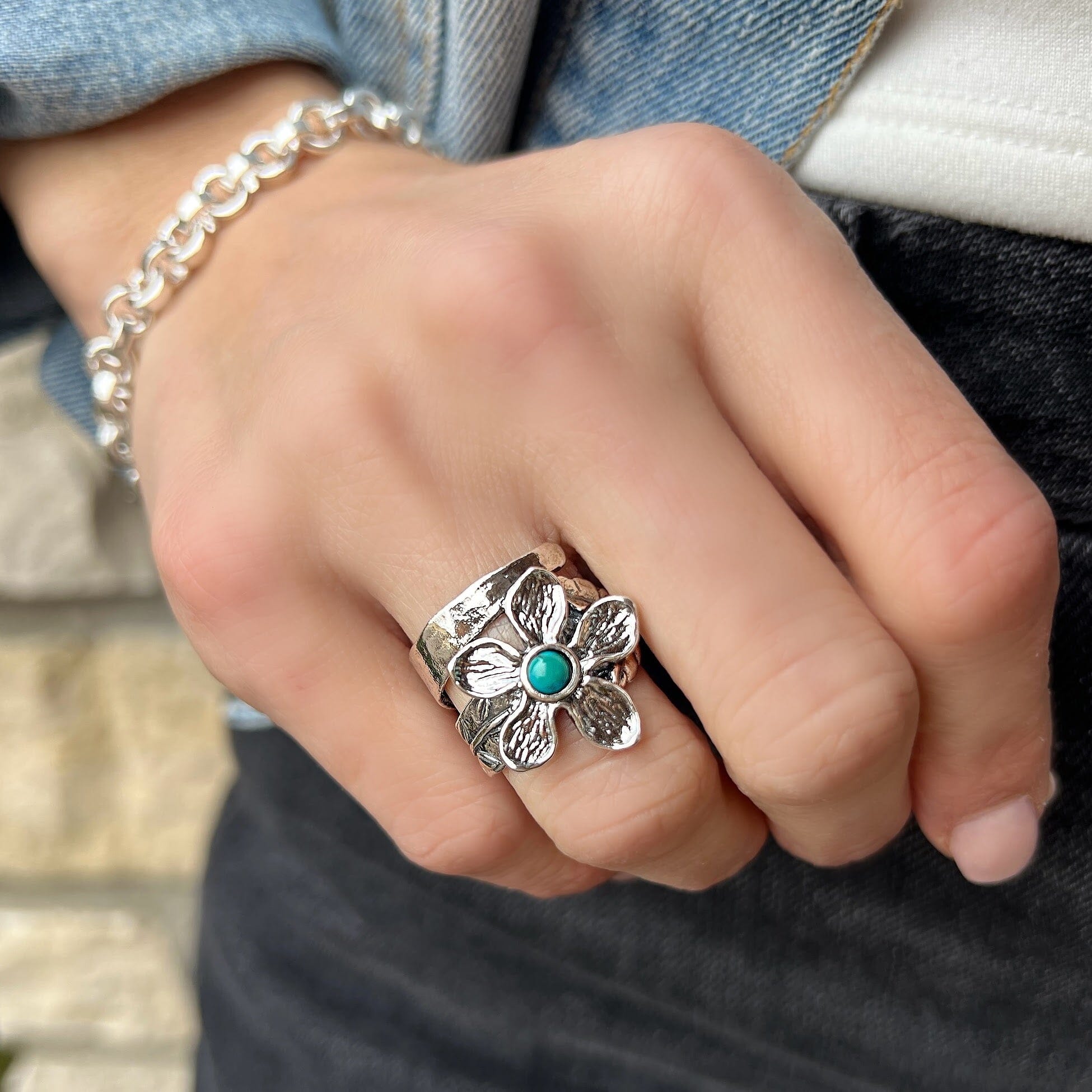 sterling silver flower detailed ring with a designed band