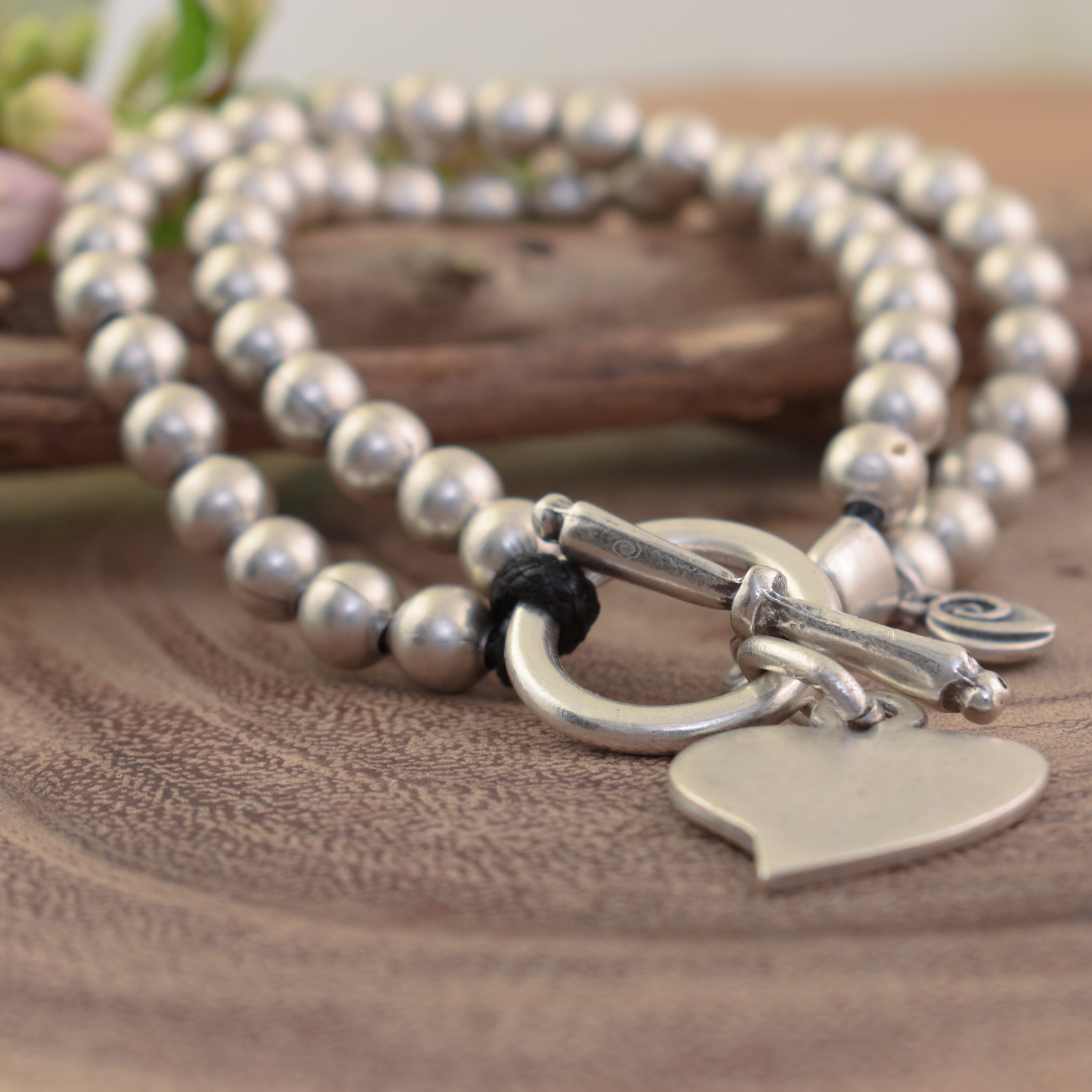 Toggle bracelet with a heart pendant