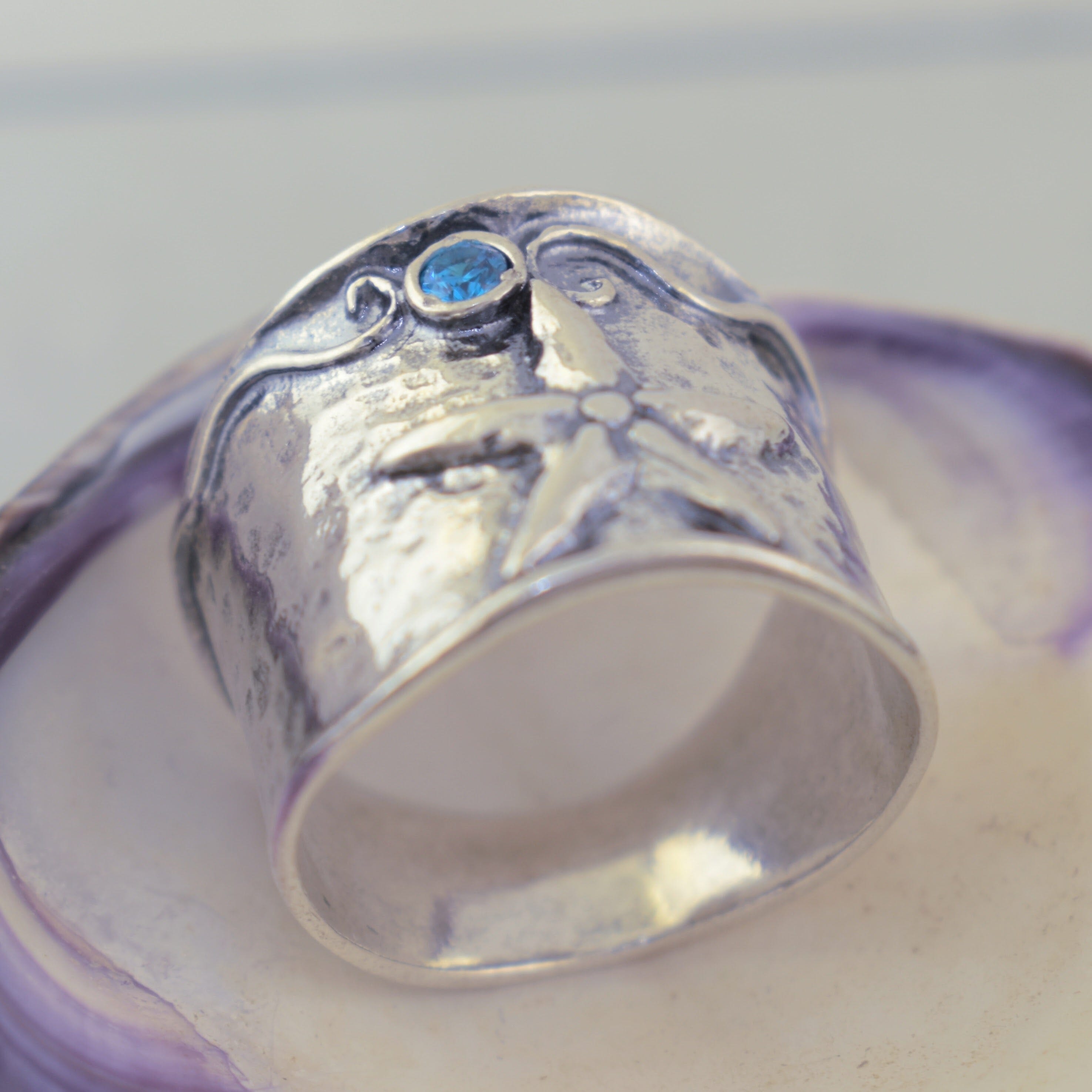 Sterling silver starfish ring with blue accent stone