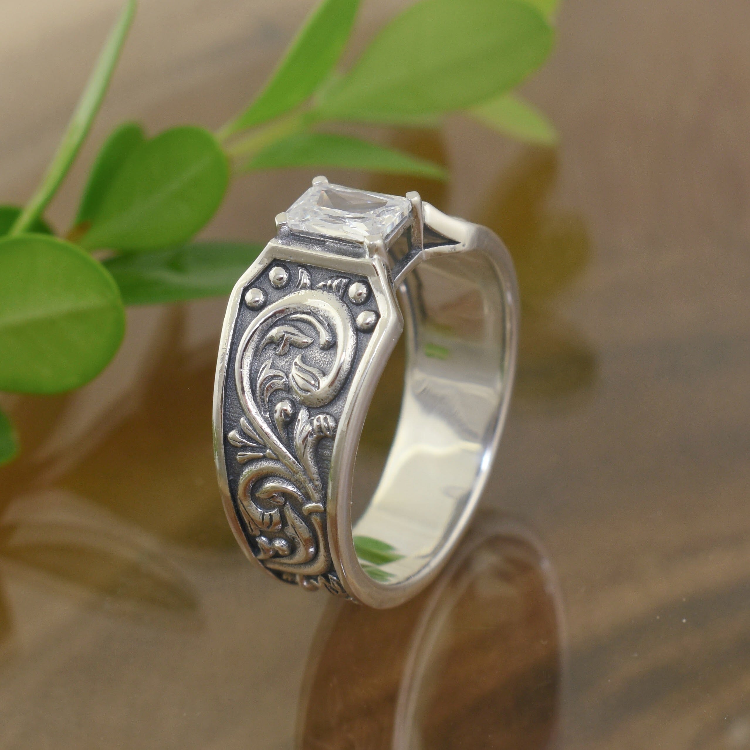 oxidized silver ring with romantic swirl details on the band