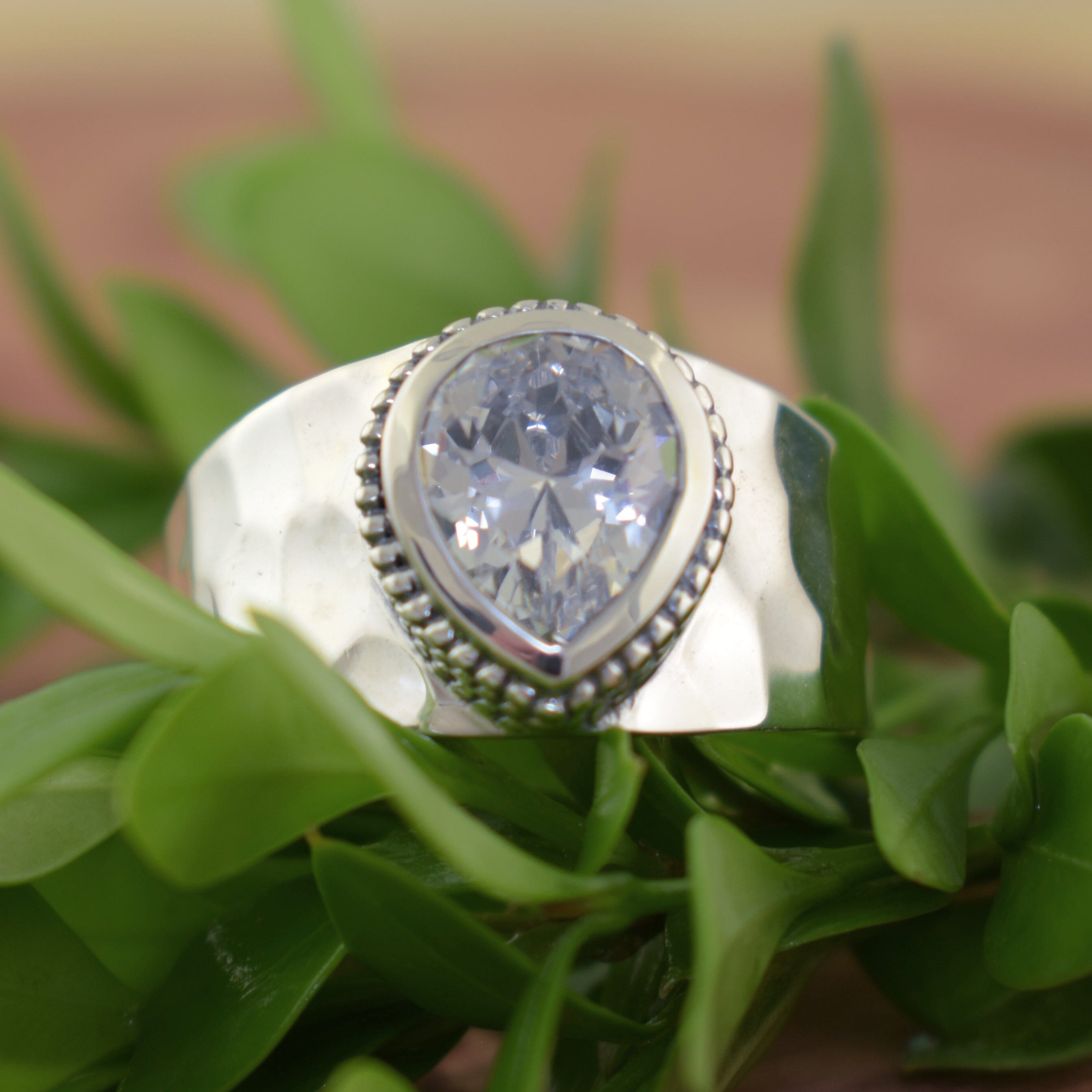 Handcrafted sterling silver ring featuring brilliant cubic zirconia