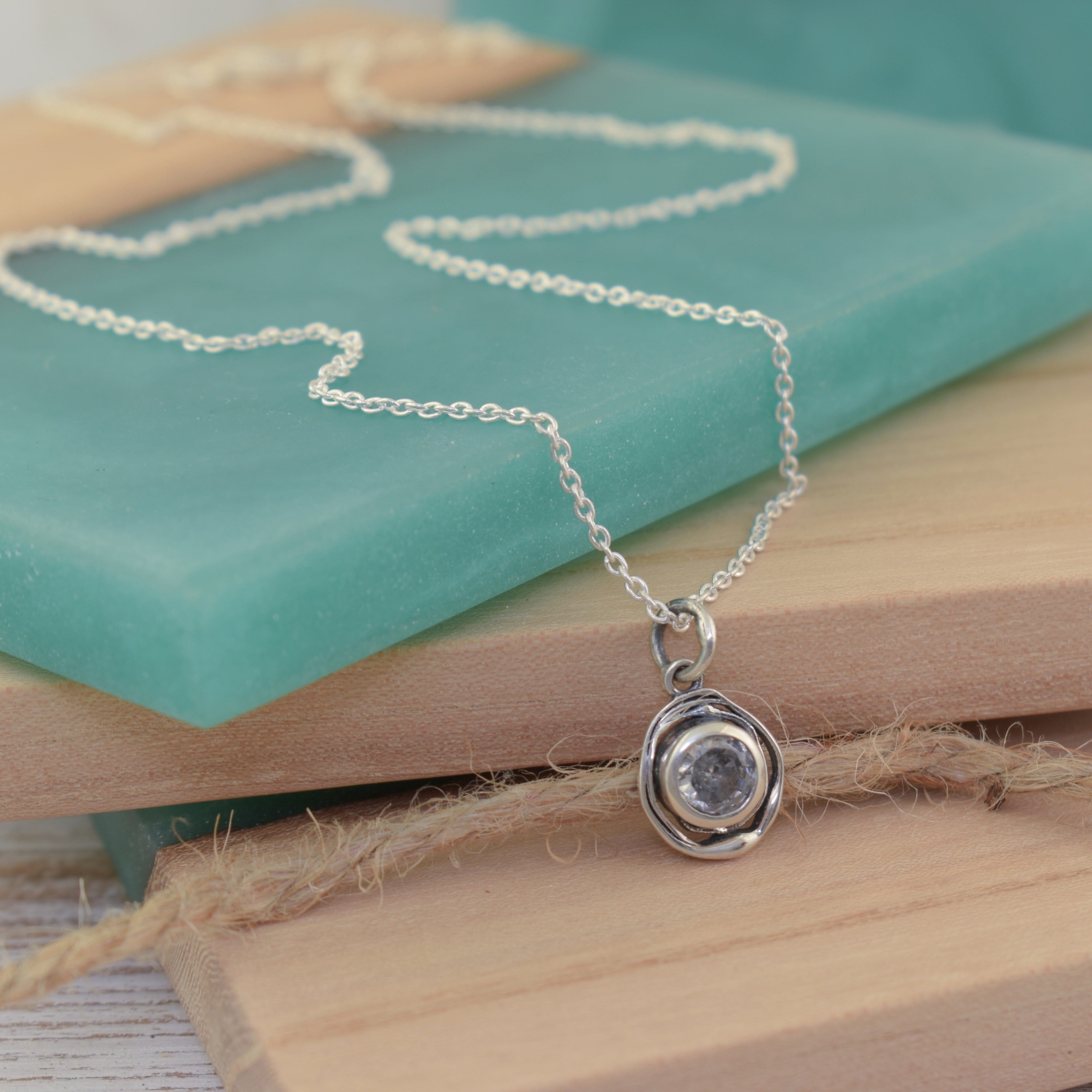 sterling silver Handcrafted necklace with a CZ stone in the pendant. 