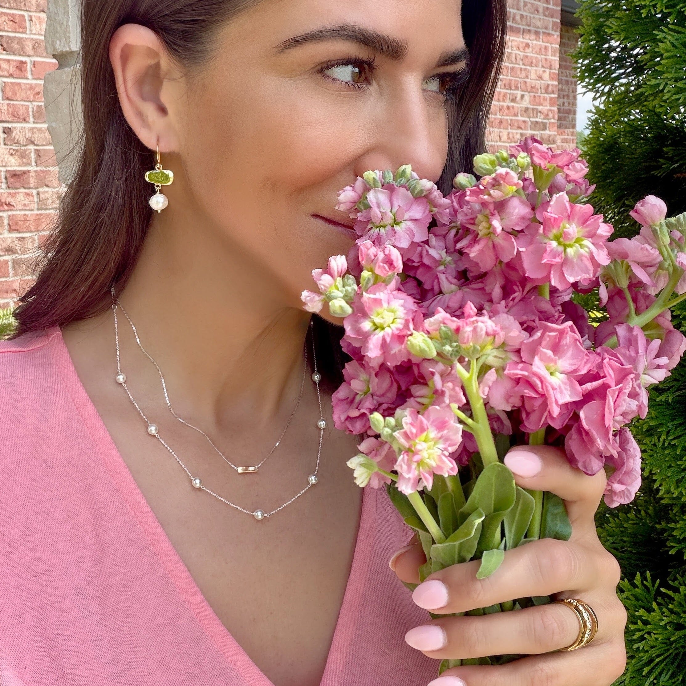 Glow with the Flow Earrings paired with two-toned jewelry