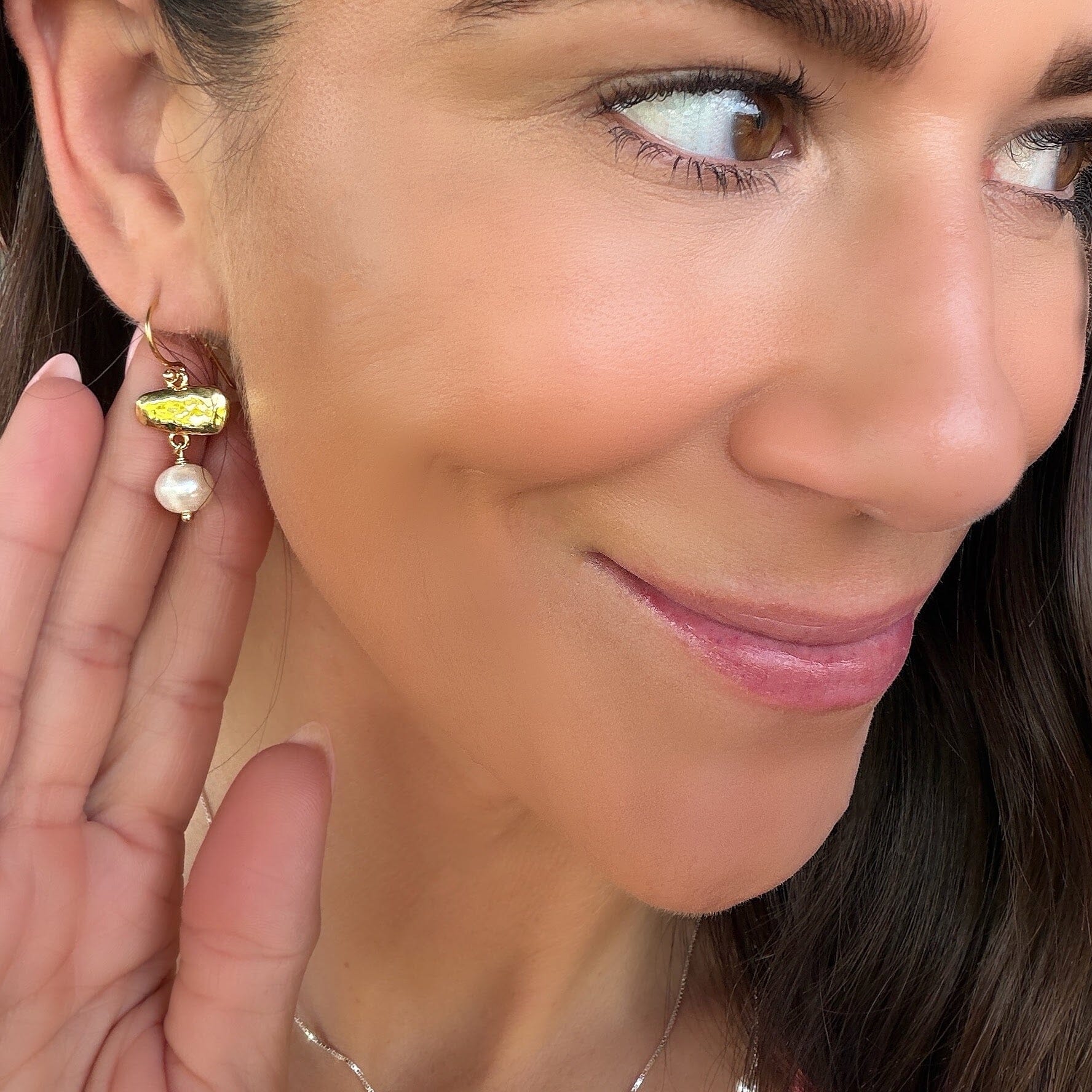 gold plated earrings featuring a freshwater pearl dangle