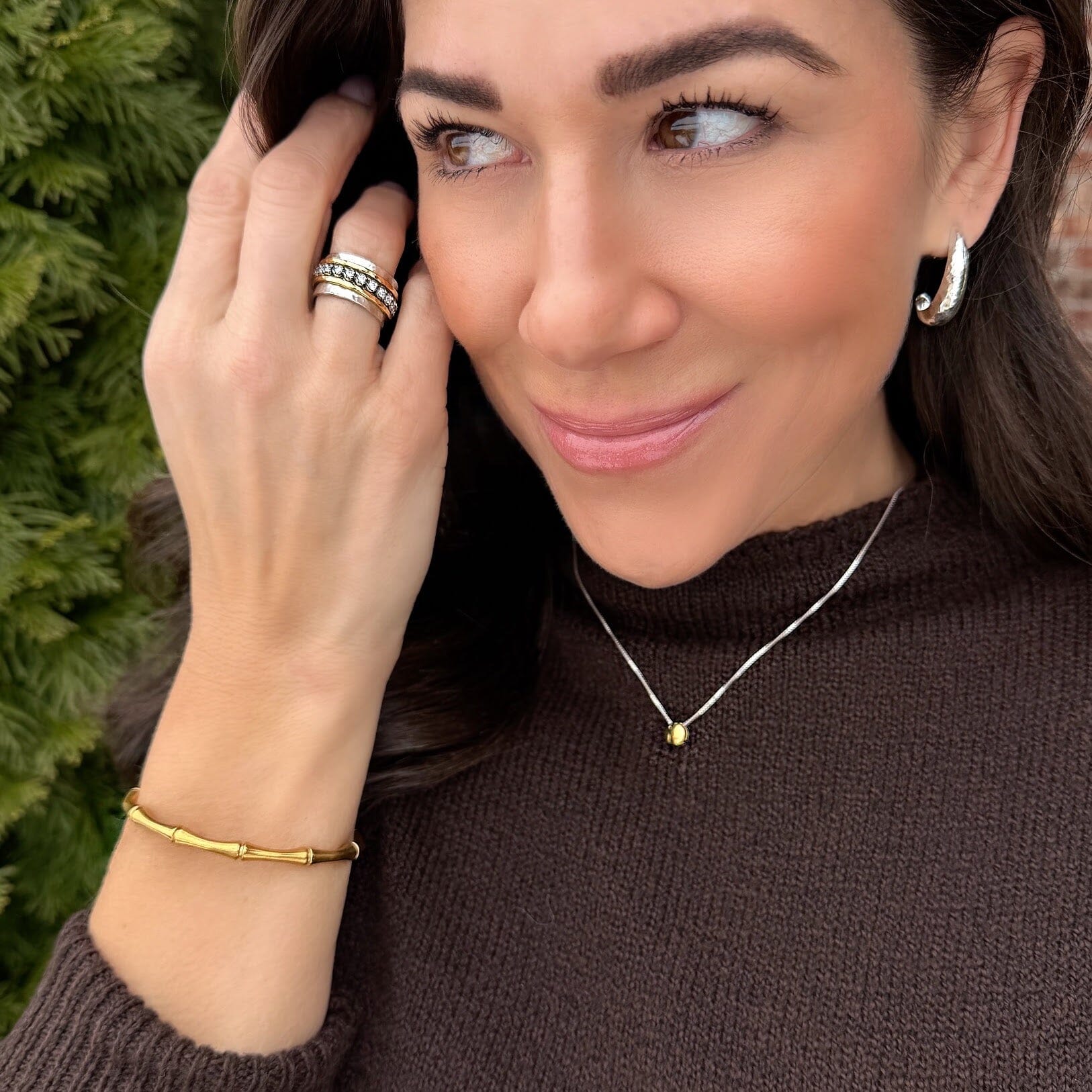 Golden Palm Cuff paired with two-toned jewelry